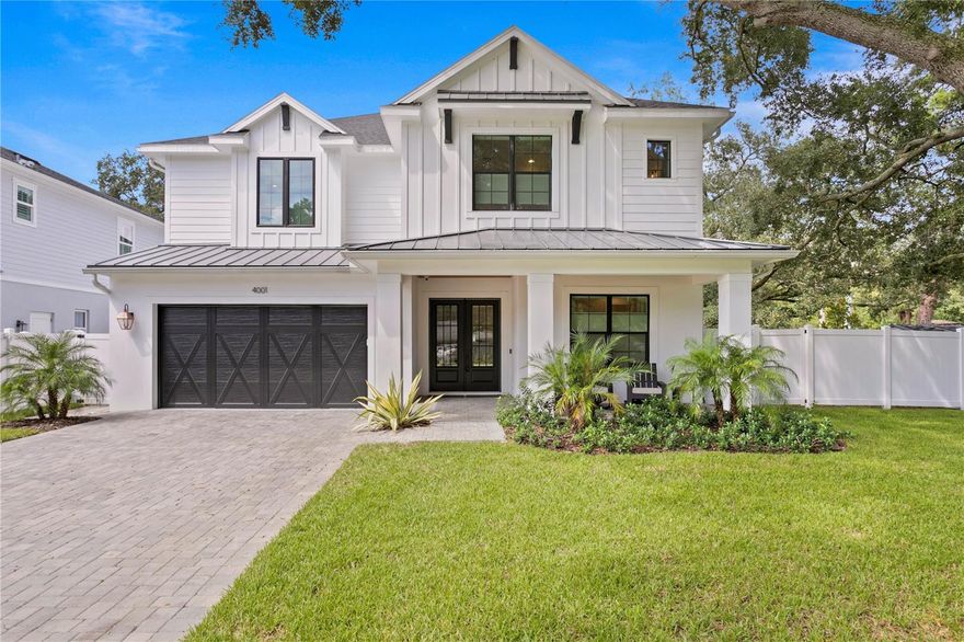 NO FLOOD ZONE. No flooding in the home or neighborhood from hurricane Helene. Welcome to your dream home! This exquisite TB Homes modern farmhouse is nestled on a sprawling 1/4-acre corner lot and exudes timeless charm with contemporary sophistication. Built with top-notch craftsmanship, the home features a durable two-story block construction, spray foam insulation, whole house generator, a whole house water filtration system and smooth drywall. From the wide plank oak wood floors to the solid core doors, every detail speaks of quality. Step inside to discover a blend of classic elegance and modern amenities, including 7" cove molding, wainscoting, and shiplap that create a distinctive aesthetic. The spacious layout offers 5 bedrooms, with one conveniently located on the 1st floor, complete with a walk-in closet and full bathroom. Multiple options are available for setting up a home office. The gourmet kitchen is a chef's delight, showcasing custom shaker cabinets reaching to the ceiling, a stylish wood hood, and an oversized island. Equipped with top-of-the-line Sub-Zero and Wolf appliances, and gleaming quartz countertops, it’s perfect for both everyday cooking and entertaining. Additional highlights include a mudroom with a bench and cubbies, a charming breakfast nook, a butler's pantry with a wine fridge, a formal dining room, a versatile office, a 1st-floor powder room, a spacious laundry room, and a media room with a kitchenette and a second powder room. The covered lanai and pool deck are adorned with elegant silver travertine laid in a French pattern. Enjoy the 32' saltwater, heated pool featuring a sun shelf, and a 6' x 12' semi-submerged spa—ideal for relaxation and fun. Located in desirable South Tampa, this home is just 10 minutes from Downtown Tampa, Hyde Park Village, and Soho. Plus, it's within an A-rated school district. Welcome home to unparalleled comfort and style!