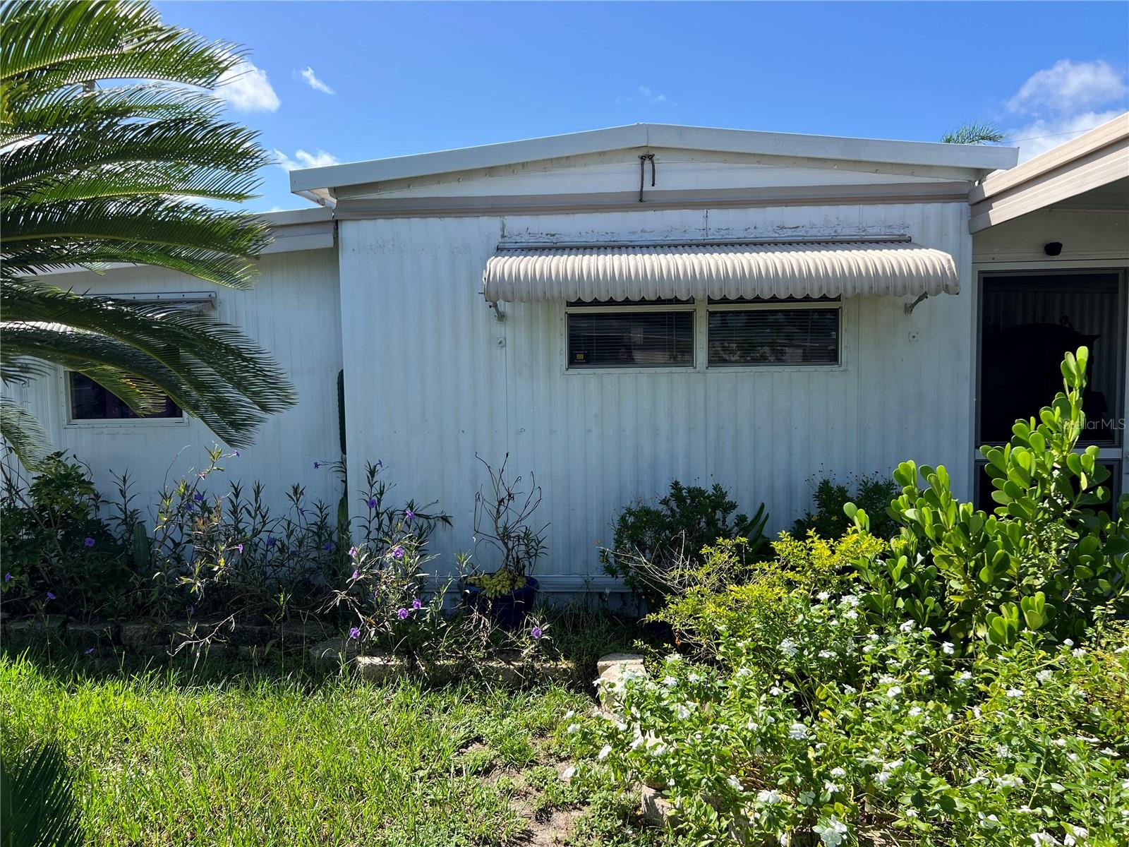 Own your land in this Charming 55+ community! Enjoy affordable living with the low HOA of just $23/monthly in this beautifully maintained home. This turnkey 2-bedroom, 1-bath residence offers an inside laundry room for added convenience and a spacious screened in room perfect for relaxing year-round. Nestled on a lovely lot with mature fruit trees. Fully furnished! Just minutes from downtown Tavares a golfcart community with shopping, dining and waterfront activities. Don't miss this opportunity to own this home!