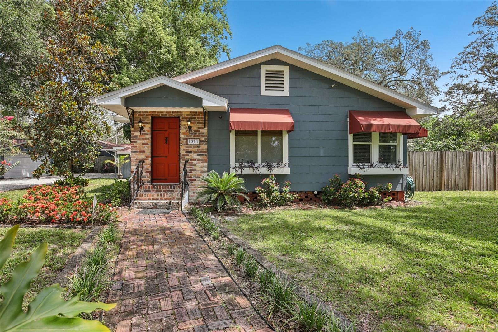 Turnkey Tampa Oasis with Pool, Two Fully Furnished Homes & Incredible Income Potential /// Welcome to “Tuckaway Grove,” a serene, turnkey Florida retreat nestled on nearly half an acre (three expansive city lots) in the heart of Tampa—just 12 minutes from downtown. Both homes are available as fully furnished. Lovingly cleaned and cared for, this property is truly a gem to experience in person. This rare, multi-structure property features a beautifully updated 2-bed, 2-bath, 1,446 sq ft MAIN HOME with a Murphy bed-equipped bonus room (ideal as a third bedroom), plus a fully renovated, detached guest cottage (ADU / Detached MIL Suite)—offering exceptional rentable flexibility for Airbnb (145 5-star reviews out of 146!), extended stays, or multi-generational living.
The main house was tastefully updated in 2021 with new flooring, paint, trim, and electrical systems, along with a few other enhancements—while preserving its Craftsman-style charm. The bright, versatile bonus room features the Murphy bed and serves as a perfect office, studio, or guest space. Newer double-pane windows, skylights, and Bahama shutters enhance natural light and energy efficiency throughout.
Across the sprawling historic brick patio, the detached guest house—an actual second residence—was completely overhauled in 2023 with all-new plumbing, electrical, central HVAC, and stylish finishes. At 625 sq ft, it features a full kitchen with island, a spacious king-sized bedroom, and a modern bathroom. The flexible lot layout allows for the easy addition of a private entrance to this structure, maximizing privacy and access.
Outdoor living is at its finest here, with a screened-in free-form pool, shaded porch, cozy firepit, pergola with swinging chairs, and beautifully landscaped native gardens under mature trees—your secluded urban oasis. Considering hosting retreats or weddings? This property would achieve those goals.
A detached 2-car garage with electricity, a covered carport, and an oversized gravel drive provide abundant parking, including 30-amp service for RV or EV charging. Three powered sheds and a built-in outdoor sink support hobbies, gardening, and extra storage. The fully fenced yard ensures privacy and pet-friendliness across the entire property. Recent upgrades include a 2023 roof and remodeled bathrooms, blending modern functionality with vintage charm.
Located near the Lowry Parcade, Lowry Park, the Hillsborough River, trendy Seminole Heights, and major travel routes—I-275, I-4, and Tampa International Airport—“Tuckaway Grove” offers unmatched lifestyle versatility for homeowners, investors, or anyone seeking a peaceful retreat with city convenience. Experience this in person!