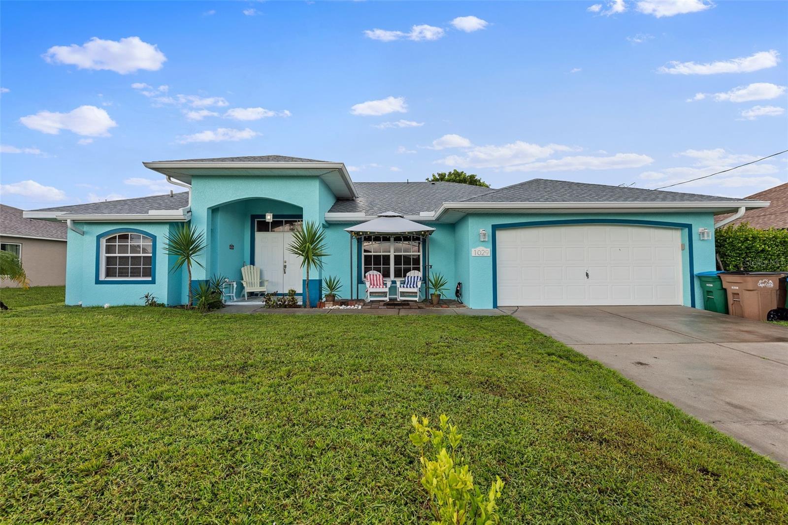 Let this lovely pool home be your new happy place. Enjoy the open concept design of this 3 bedroom 2 bath home
featuring spacious living areas on both sides of the kitchen. With multiple sliders that access the under-truss lanai and screened-in pool, you
will relish the abundance of natural light inside and out. Maintenance is a breeze with all porcelain tile flooring. Cooks will love the ample
kitchen counter space and quiet dishwasher. Other notable features include reverse osmosis in kitchen, hurricane rated windows and doors,
shelving units on garage ceiling and in master bedroom, electric pool heater and high quality, durable Diamond Brite pool surfacing. Outside,
harvest edibles from you own trees-mango, citrus, moringa, neem and black sapote. Situated in a NON-FLOOD ZONE and convenient location,
this house is a must see!
