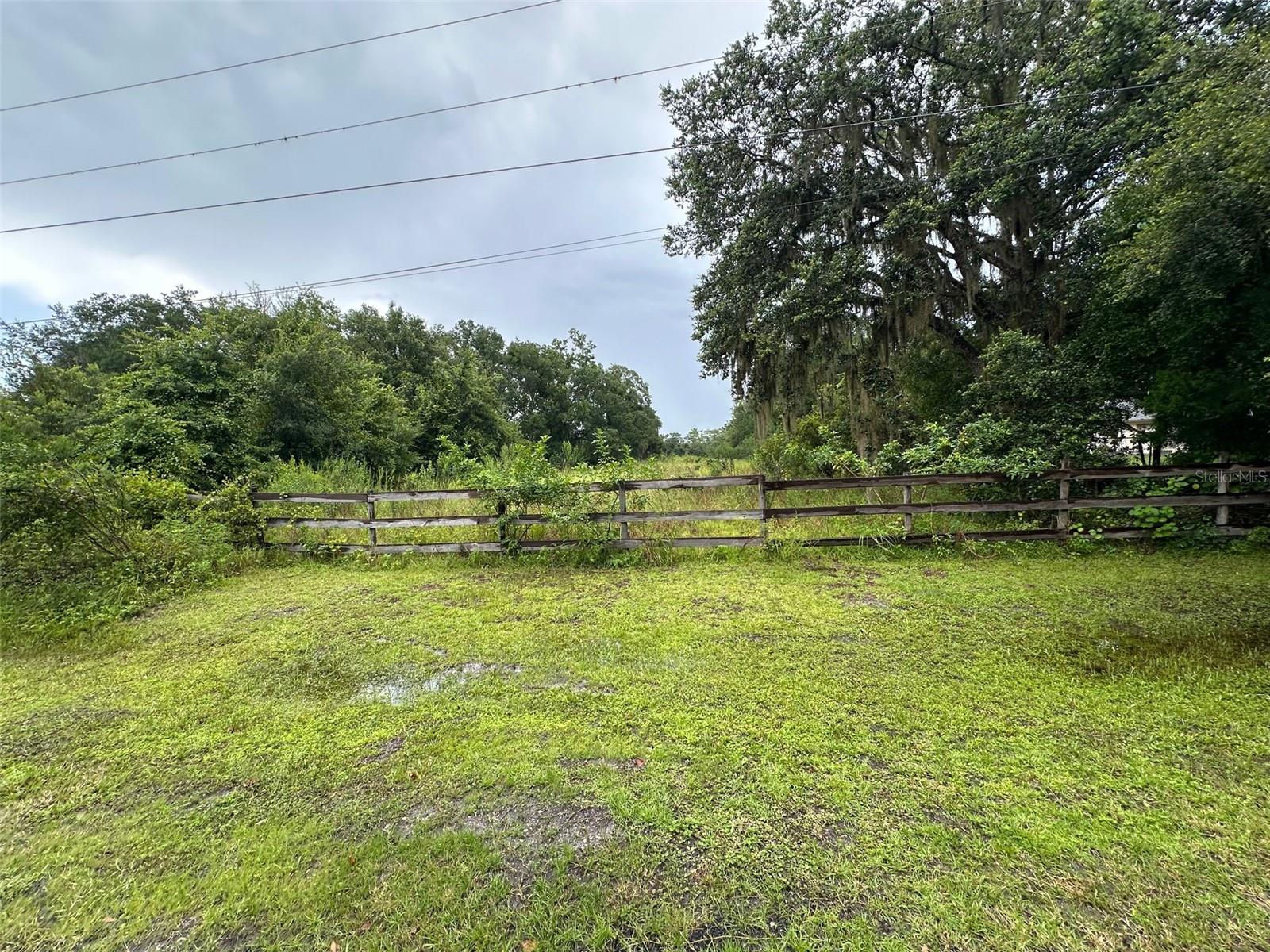 Opportunity to own 1.38 acres in rapidly developing East Orlando (Christmas, FL).
This partially cleared property offers dual zoning—C-1 commercial at the front and A-1 agricultural at the rear—providing flexibility to either build your dream home or establish a business. Conveniently located near Waterford Lakes, Avalon Park, I-95, and the new East Orlando Soccer Complex, this lot is ideally positioned for future growth and investment potential. Bring your offers today!