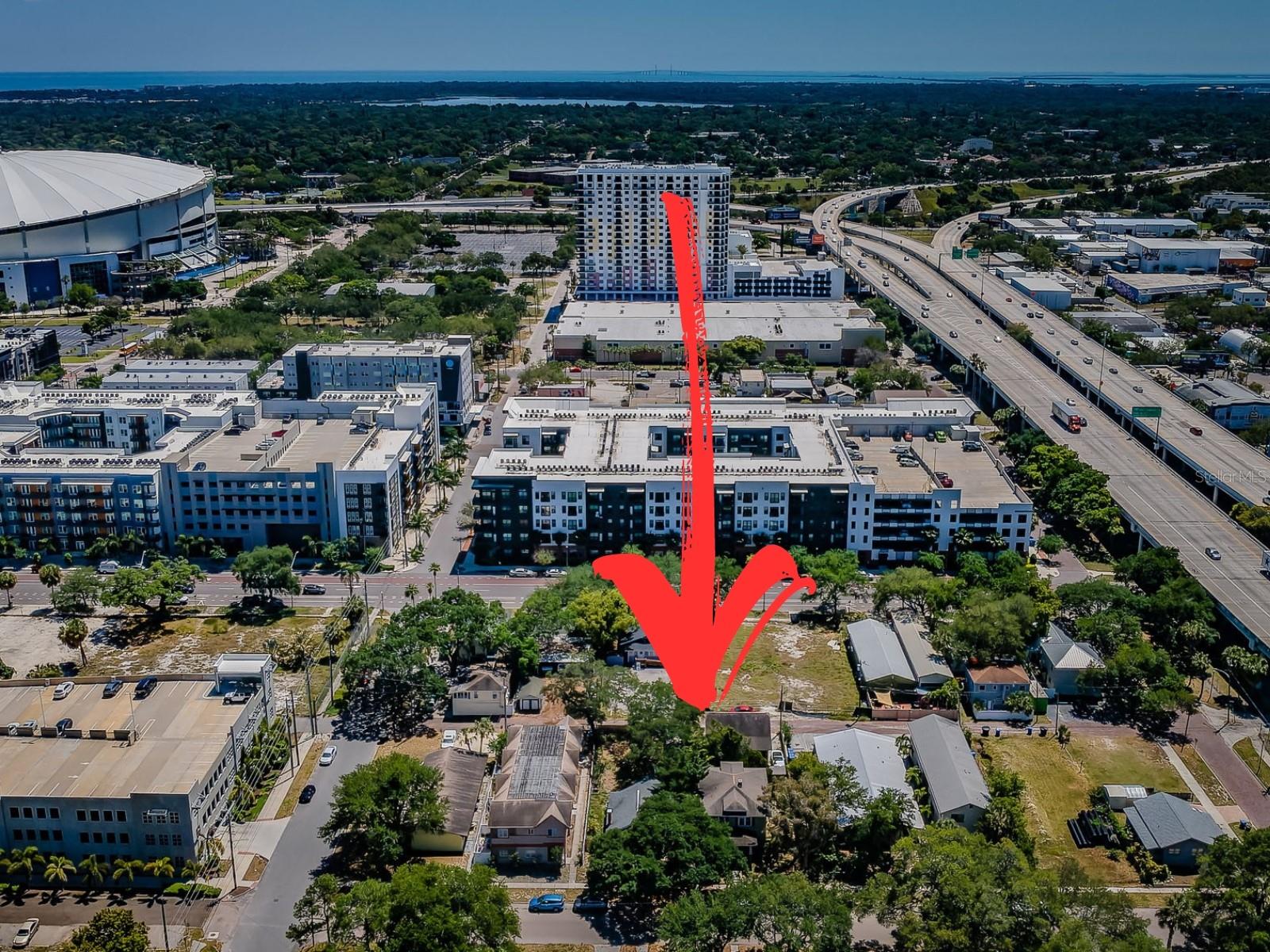 **This listing encompasses two adjacent DC-2 zoned lots, 1720 and 1726 2nd Ave N, with the listing price representing both lots' combined value.**. Presenting a remarkable development opportunity in the heart of St. Petersburg, just two blocks north of Central Ave — a vibrant and rapidly evolving part of the city. Spanning a generous 12,700 square feet total, 100 x 127 ft in dimension, this prime location offers a wealth of potential given the immediate proximity to the Edge District, Grand Central, and the soon-to-be redeveloped Tropicana Field. The DC-2 zoning allows endless opportunities for mixed-use or residential development. Imagine crafting a mid-rise complex featuring luxurious apartments, chic condos, or a townhouse community with rooftop decks; all are viable options given the DC-2 zoning. With conceptual designs in hand by local architect Behar + Peteranecz, the plans illustrate two buildable options that conform with zoning. These forward-thinking designs include spacious 3-story homes, each with a roof deck perfect for capturing panoramic city views and over 1,900 sqft of living space alongside convenient ground-level garages. Or, should you choose to pursue larger developments, the plans illustrate a 32-unit apartment/condo complex with the potential to increase the unit count to 54 units by going through the bonus approval process. Nestled on a serene, tree-lined brick street, yet a brisk walk from Central Avenue's array of boutique shops, restaurants, and bars, the site relishes a quieter setting paired with the allure of city living. This development opportunity is not just a property but the promise of a future landmark contributing to the dynamism of Downtown St. Petersburg. Explore the endless possibilities of a location where development dreams have the potential to become a reality. Renderings based on conceptual designs, not permitted plans.