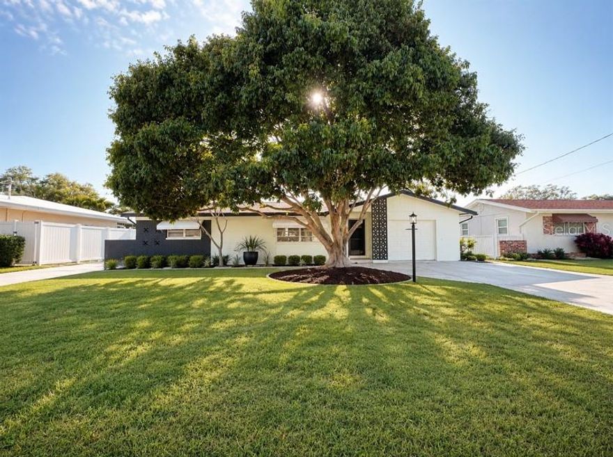 One or more photo(s) has been virtually staged. Welcome to this beautifully updated Ridgewood Grove lakefront home with serene waterfront views. Minutes away from Pinellas Trail and the Gulf beaches. This home offers a new roof being installed (5/2026), freshly painted outside and inside, updated kitchen with wooden cabinets; new stainless steel appliances - smooth-top range, microwave, dishwasher (5/2026), attractive granite counter-top with a large raised breakfast ledge that could seat five, modern light fixtures. Also included are new blinds, new doors and handles installed throughout the home. Upgraded bathrooms, 3 new ceiling fans with remote control.
Large great room with easy maintenance terrazzo flooring. Your private outdoor oasis awaits with a screened Florida room plus an additional brick pad for grilling. Ideal for year round enjoyment whether you're hosting gatherings or unwinding after a long day, this generous size backyard delivers the Florida lifestyle you are looking for. This home is move-in ready. Come and ad your personal touches before it's gone. This home is a rare find. NO HOA or CDD.  Owner offers a one year Home Warranty at closing. No flood insurance required! Roof warranty is transferable. This home offers a great opportunity to expand on the square footage by adding windows and heat to the screened porch, converting into an enclosed Florida room. Opprtunity is knocking. Call  today.