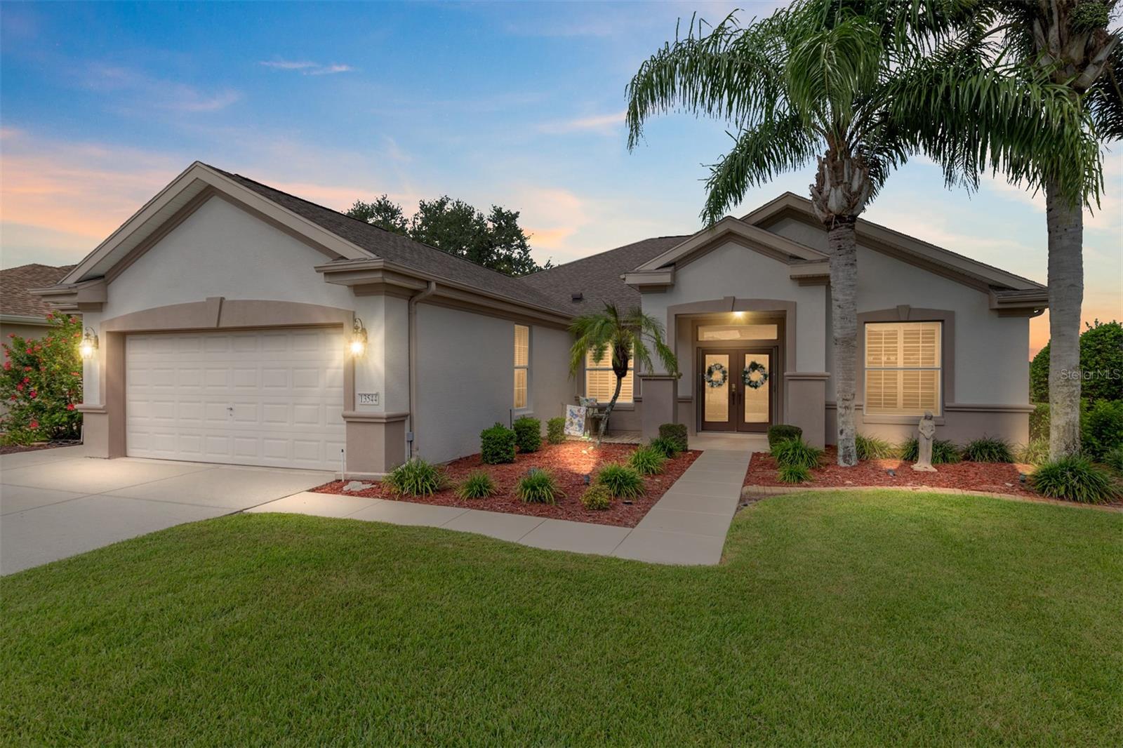 One or more photo(s) has been virtually staged. The spectacular views of Holes 2 and 3 of the Memorial Golf Course set the stage for this beautifully maintained Hanover model with 3 full bedrooms and 2 baths. From the moment you arrive, the professional landscaping, decorative curbing, and inviting front patio create a lasting first impression. Step through the double leaded glass doors and be greeted by sweeping golf course views that continue throughout the home. Impeccably clean and move-in ready, this CBS home offers tile flooring throughout and a climate-controlled enclosed lanai with a split system for year-round enjoyment. The kitchen features granite counters, birch cabinets, and stainless steel appliances, while the remodeled primary bath adds a touch of luxury. Plantation shutters, a built-in entertainment center in the Great Room, and a built-in desk in the third bedroom further enhance the home’s appeal. Additional upgrades include a tankless Rinnai water heater, freshly painted epoxy garage floor, and an extended by 4-foot garage with a dedicated golf cart garage. Major systems are up to date with a new HVAC installed in August 2025, roof replaced in 2014, and re-piped ceilings and walls. An assumable termite bond adds peace of mind.This rare Hanover with golf course frontage is truly a must-see. Call today for your private showing—opportunities like this don’t last long!