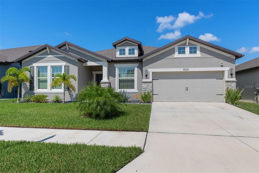 Photo of 9539 Ibis Grove Boulevard, Wesley Chapel, FL 33545 (MLS # TB8412716)