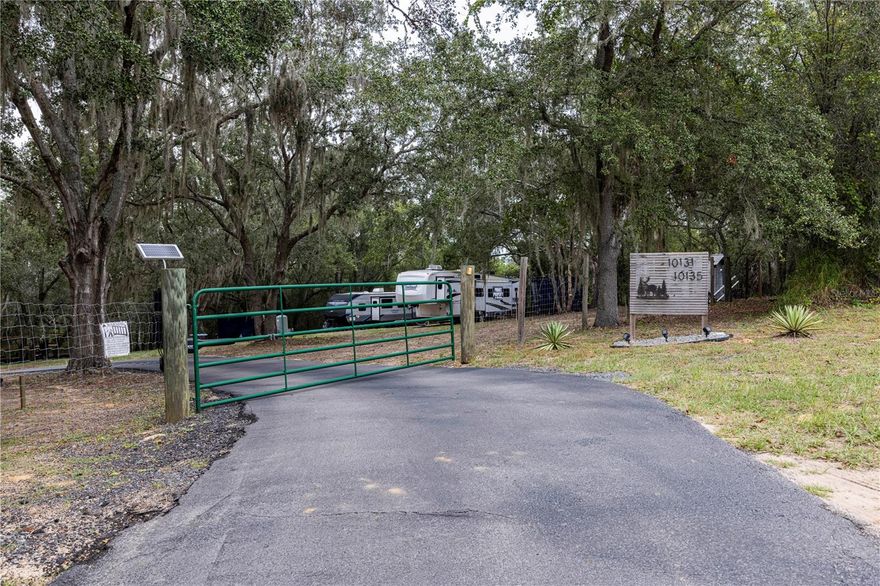 Looking for a Family Compound? This is a "Must See it for Yourself" kind of property...2 Homes on almost 5 acres with RV Hookups! Do Not Miss this Opportunity! This property offers a unique blend of convenience, modern amenities, and natural tranquility with an amazing Lakeview. Sitting on 4.75 +/- acres this property has been thoughtfully developed with a paved access road extending from the entry gate to each of the two manufactured homes. The property includes 2 double-wide manufactured homes built in 2019, each with its own address. The home located at 10131 offers 1456 square feet with 3 bedrooms, 2 bathrooms along with an open floor plan. You will love cooking supper in this kitchen!  The 2nd home located at 10135 offers 1152 square feet with 3 bedrooms and 2 bathrooms and a beautiful open floor plan as well. Both homes were built in 2019 and were installed in 2021. Each home features several upgrades such as laminate flooring throughout, premium appliances and so much more! The homes are well-insulated, maintaining a steady temperature throughout both hot summers and colder winters. The well pump was upgraded in 2023 with a new Pelican Water Filtration System. Each home has its own power meter and shares a joint septic tank. There are also two RV hookups, each 60 AMP, water RV connection points and a septic tank exclusively for the RV spots. Zoned for agriculture, this property is ideal for those interested in keeping animals or pursuing harvest projects. There are several water points for convenience along the property. The lot is canopied with numerous oak trees and other vegetation, contributing to a cool environment even on the hottest days. Nature enthusiasts will appreciate the abundant wildlife, including frequent visits from Sandhill Cranes and deer. You also have a 40’L x 30’H x 17’T Pole barn currently being enclosed along with an additional shed for extra storage. And do not worry, connectivity is excellent, with fiber optic internet service available. If you are seeking a peaceful and beautiful retreat close to the city for convenience but far enough away to enjoy a rural country lifestyle then you do not want to wait. Call for a Private Tour Today! (RVs on site do not convey). Entertaining Cash, Local Lenders or VA offers. Check out the Virtual video!