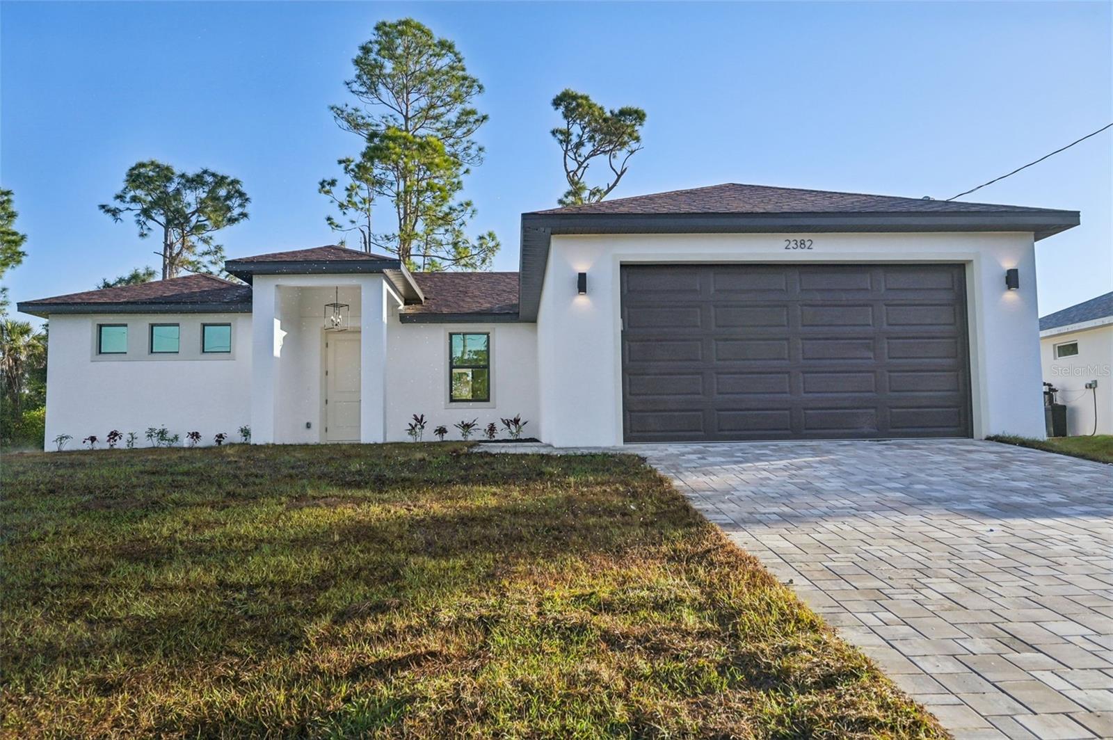 One or more photo(s) has been virtually staged. Under Construction. One or more photo(s) has been virtually staged. Estimated Completion July 2025! This 3-bedroom, 2-bathroom, 1,610 SF living area home, located in North Port offers a modern and free flowing design adorned with luxury finishes. Enhanced with high ceilings and large high-end energy efficient impact windows, the interior features an open-concept living room that provides additional space for your dining and entertaining needs. The kitchen features stainless steel Samsung appliances, quartz countertops, and an oversized island. Enjoy a master suite with a walk-in closet and a double vanity bathroom. The beautiful area of North Port offers residents a premier location with easy access to a multitude of water recreation opportunities, plus easy access to the Gulf of Mexico’s best beaches.