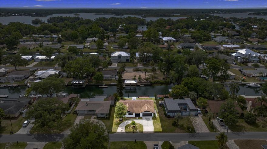 Waterfront Living in the Pretty Springs Community — 80+ Feet of Spring-Fed Frontage with Direct Gulf Access!
BUYER INCENTIVES: Seller will replace the existing dock/fishing pier or provide an agreed-upon credit toward a boat lift. No HOA or CDD!
Experience true coastal Florida living in this beautifully updated 3-bedroom, 2-bath waterfront retreat, ideally situated just off Kings Bay in Crystal River. Set on clear, spring-fed canals sourced from Three Sisters Springs, this property offers an extraordinary lifestyle where manatees, dolphins, and world-class fishing are part of your daily routine.
Step inside to discover a thoughtfully modernized interior featuring new luxury vinyl plank flooring, hurricane-impact windows, and a charming wood-burning fireplace for those cool Florida evenings. The fully conditioned and heated Florida Room expands your living space year-round—complete with skylights, a custom bar, and panoramic water views that capture both sunrise and sunset light.
The updated kitchen showcases brand-new appliances and an open, functional layout designed for entertaining, effortless cooking, and seamless coastal living.
Outside, your private waterfront oasis awaits. With 80+ feet of SPRING-FED frontage and no bridges or height restrictions, you’ll enjoy quick and easy access to Kings Bay and the Gulf of Mexico—ideal for family vessels and avid anglers. Whether you're cruising, paddling, or simply relaxing dockside, this property delivers the ultimate Crystal River experience.
To further enhance the value, the seller will replace the existing dock/fishing pier or offer a credit toward a future boat lift—your choice.
Enjoy the best of Crystal River living, where adventure, natural beauty, and tranquility meet right at your doorstep.
Disclaimer: Buyer and Buyer’s Agent are responsible for conducting all due diligence and verifying all information independently. All information is deemed reliable but not guaranteed.