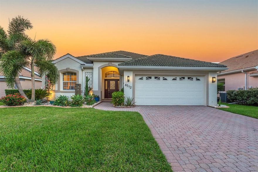 Price Reduced and Ready to Sell!  If you want privacy and a large back yard with a gorgeous pool, this is a must see!  Tucked away in the sought-after neighborhood of Mote Ranch, adjacent to University Park Country Club, with EXTREMELY LOW HOA fees and fantastic amenities, this 3-bedroom, 2-bathroom gem offers the perfect blend of luxury, comfort, and convenience. With a 2-car garage, tile roof with 20 years of life left, and a long list of premium upgrades, this home is move-in ready and made for modern living.  Step inside to soaring high ceilings, all-new ceiling fans, and a no-carpet interior that feels fresh and contemporary. The open-concept kitchen and family room combo is ideal for everyday living, while the massive living/dining room offers the perfect flex space for a home office or entertaining.  This home's chef's kitchen features stone countertops, a built-in range and oven, and a sleek, modern design that flows effortlessly into the living space. The updated master bathroom and walk-in closet in the large primary suite add to the home’s luxurious feel.  Your private backyard oasis awaits with a heated saltwater pool and spa, enclosed in a no-see-um proof pool cage for year-round enjoyment. Surrounded by stone landscaping, professional outdoor lighting, and no rear neighbors, this space is perfect for relaxing or entertaining in total privacy. This smart, secure & efficient home boasts a whole-home water purifier, filtration, and softener system, new AC (2023) for peace of mind, 3 Nest security cameras for added security, hurricane shutters for every window + soft shutter for the lanai, connection to a whole house generator system, seamless gutters, full irrigation system, and so much more. This home checks every box—luxury finishes, smart upgrades, and a location that can’t be beat. Enjoy access to a clubhouse, pool, and playground, all while being just minutes from top-rated schools, UTC shopping, dining, and more.  Schedule your private tour today and experience the lifestyle you’ve been dreaming of!