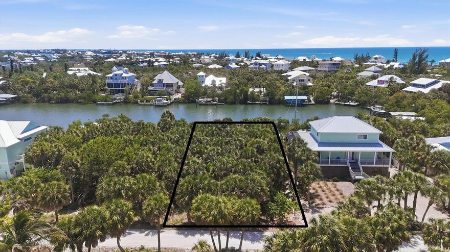 Do yourself a favor and take a look at the photos of this waterfront property.  If you've been looking for a sanctuary to build your Florida home, this is the perfect location for you.  The lot has 80 feet of waterfront on a wide saltwater canal.  Some of the deepest water offered with great views on Palm Island.  There is plenty of room for a dock and large boat.  There are no bridges to the intracoastal and the Gulf of Mexico.