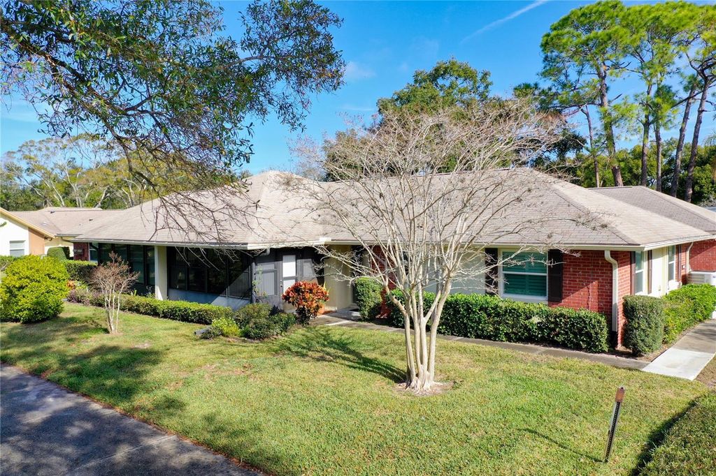 Photo of 1424 Stonehaven Lane, Dunedin, FL 34698 (MLS # TB8460857)