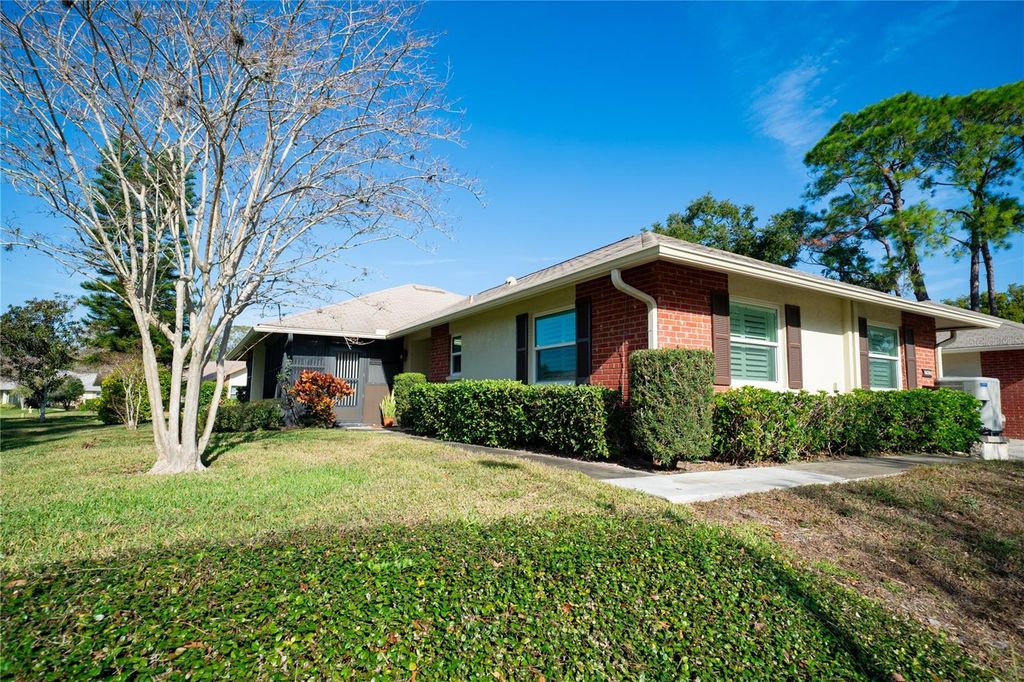 Photo of 1424 Stonehaven Lane, Dunedin, FL 34698 (MLS # TB8460857)