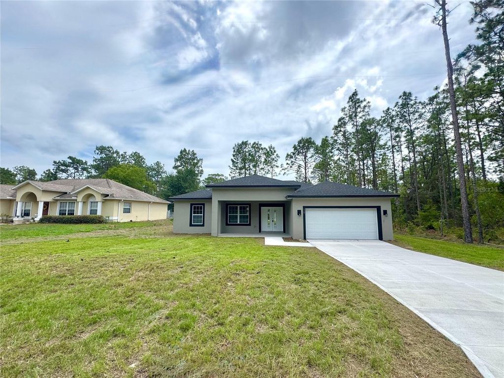 Photo of 628 W Heronsbill Lane, Dunnellon, FL 34434 (MLS # O6312951)