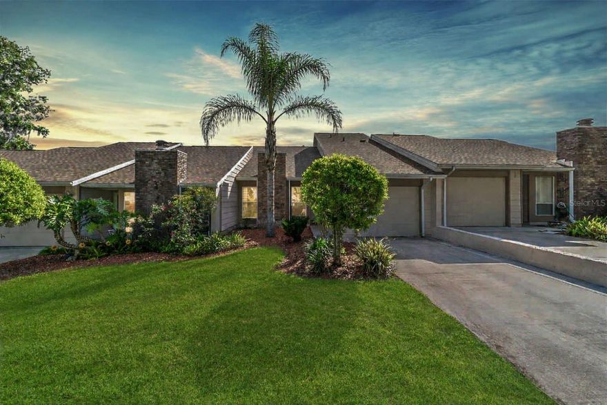 Look no further than this beautifully updated 2-bedroom, 2.5-bath townhome in the gated Woodland Villages community, which delivers effortless style, comfort, and a modern edge. Bright and airy throughout, this townhome has been recently refreshed to include luxury vinyl plank flooring, elegant crown molding accents, updated lighting, and ceiling fans throughout. The inviting living area is enhanced by recessed LED downlighting and soaring vaulted ceilings, creating a bright, open atmosphere ideal for everyday comfort and entertaining. The stunning kitchen complements the space with crisp Shaker-style cabinetry, quartz countertops, a chic tile backsplash, stainless steel appliances, a center island for additional prep space, and a dedicated pantry that provides ample storage. Glass inset French doors from both the kitchen and primary suite open to a spacious screened-in patio with composite decking, creating a perfect space for outdoor living and entertaining. The first-floor primary suite offers an elegant bath with a double quartz vanity and a beautifully tiled shower, complemented by a refreshed half bath nearby. A custom metal staircase leads to the open loft, providing ideal space as a second living area or home office, and to the upstairs bedroom with its own newly tiled en-suite bath. Major 2021 upgrades include a new roof, water heater, new windows, and all-new interior and exterior doors for priceless peace of mind. Enjoy an in-town lifestyle with the ease of gated community living and no yard work required. Take advantage of the community pool, a clubhouse perfect for gatherings, and a nearby community tennis court just a short stroll away. You’re only minutes from downtown Ocala, local dining, shopping, and major highways that make travel simple and stress-free.