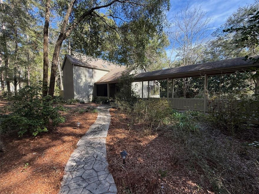 Welcome home to this light-filled Haile residence featuring soaring ceilings and a desirable split floor plan. This charming 2-bedroom, 2-bath home also offers a versatile office or nursery, perfect for working from home or growing needs. Enjoy seamless indoor-outdoor living with a screened porch overlooking a large, private lot, ideal for relaxing or entertaining.

Additional highlights include a garage and a peaceful setting on a quiet cul-de-sac. Best of all, you’re just a short walk to Haile Village, where you can enjoy the weekly farmers market, restaurants, banking, and more. This home combines comfort, convenience, and the lifestyle Haile is known for.