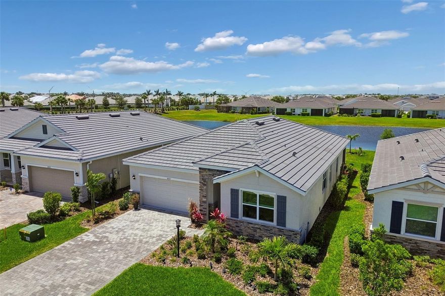 One or more photo(s) has been virtually staged. There are places you move to because you need a house.  Then there are places "You Choose" because something inside you is ready for a "New Life".  Welcome to Star Farms at Lakewood Ranch —a place where mornings feel softer, evenings feel fuller, and every day carries the quiet promise that life can still surprise you.
Here, home is more than walls and a roof. The warm sunshine you feel sitting on your lanai with your first cup of coffee as the Florida sun comes up awaiting "Your New Life-style". The life that is "I'm done dreaming" "I'm finally moving to Florida" Everything you can imagine and only a short half hour drive to the Best Beaches in the world! The day filled with activities and all the way to the evening golf cart ride after dinner, the sound of neighbors becoming friends, the peaceful lake view beyond your backyard, and the feeling that you are finally living somewhere that gives something back to you. This is resort-ranch living with soul.  A community designed for connection, movement, wellness, and ease~ where you can spend the morning at the fitness center, meet friends by the pool, walk the trails, enjoy the dog park, play pickleball, or enjoy the restaurant..being outside and remember what it feels like to breathe. Star Farms was created for those who want more than a beautiful home. It was created for those who want a beautiful rhythm of life. The Country Beachy lifestyle...wait until you see the exclusive Adventure Retreat and have the experience you've been dreaming of —a setting that invites you to live actively, socially, and fully, while still coming home to peace. On the quiet street of Beach Ranch Terrace, the story becomes personal.  A nearly new 2024 Emerald series luxury home with over ($40,000 in upgrades), beautiful brick pavers and an elegant yet tough lasting real tile florida roof. The upgraded enhanced landscaping with Palm trees and lighting adding to the curb appeal. This one level living designed spacious with 3BR, 2BA split floor plan for privacy, plenty of closet space, and serene lake views, this home offers (Brand New Furniture Negotiable) the comfort and ease of simplicity moving to Florida. The open floor plan, stone counters, impressive kitchen island, walk-in pantry, smart-home features are some of the main features. The additional upgrades Accent wall, beadboard detailing on the island, and wainscoting with chair rail throughout the main living area. Adding the impressive lighting pendants hanging over the center island and also new upgraded lighting and fan fixtures throughout, creating light-filled spaces in every room-including epoxy garage flooring. The screened patio and water view invite you to slow down, exhale, and enjoy the life you worked so hard to create. This is the kind of home where you could wake up each morning with purpose. Where you could host the people you love. Where you could walk out the door and feel connected. Where you could finally stop waiting for vacation —because life itself starts to feel like one.  Star Farms is not just a community. It is a reminder that your next chapter can healthier, and more alive than the one before it...And maybe that is the real luxury...not just the home...not just the amenities...not just the Lakewood Ranch address. But the feeling of coming home to a beautiful sunset and a life that finally feels like yours. Call for a tour of this exclusive home in Adventure Retreat and learn about what Star Farms has to offer ~ you ~ Today!