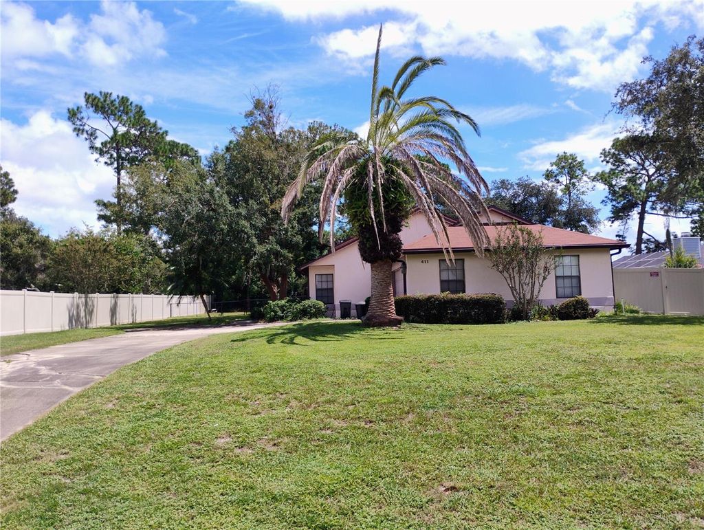 Photo of 411 Glen Abbey Lane, Debary, FL 32713 (MLS # W7879858)
