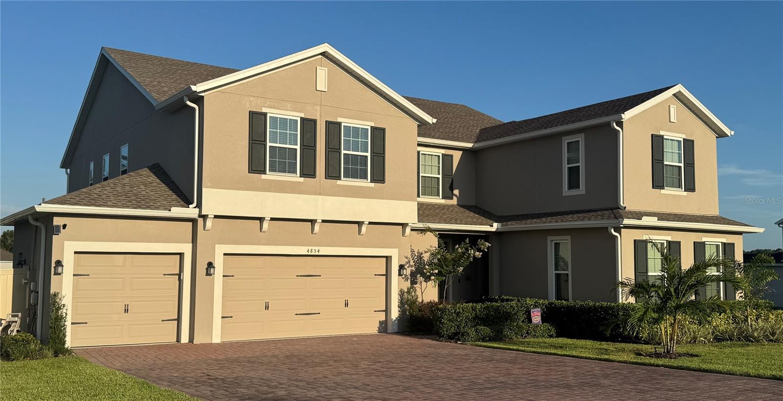 Your search is over! This stunning like-new late 2023 home is located in the wonderful Bargrove Estates community. Featuring oversized lots, a central park and playground, and fantastic views, this small, executive community is hard to beat. This home is the definition of move-in ready! The home features an expansive floorplan, including 7 bedrooms, 5 ½ baths, and a huge upstairs bonus room. The In-Law suite features a private access door at the front entryway. Upon entering, you will find crown moulding foyer leading into the formal dining room and the first of two staircases, a half bath, and the In-Law suite which features it's own full bath and walk-in closet, along with cabinetry and kitchen plumbing. The open kitchen is complete with 42-inch fully trimmed cabinetry, like-new stainless-steel gas appliances, an expansive island, a closet pantry with sliding barn door, and an eat-in casual dining space. On the first floor, you will find a private guest wing with a nicely sized bedroom, walk-in closet, and full bath. The kitchen overlooks the spacious family room, which features a wall of windows letting in plenty of natural light. Oversized sliding glass doors lead into the home’s covered porch area, plumbed for an outdoor kitchen with gas. The first floor and garage are also home to several custom built-in features. Upstairs, you'll find the expansive master suite, which features dual walk-in closets, dual vanities, a walk-in shower with upgraded electronic temperature control and dual shower heads, and a separate garden tub. The large media/bonus room and 4 additional generously sized bedrooms plus 2 full bathrooms are also located upstairs. Some upgrades and features throughout the home since the original closing include fresh interior paint throughout, fresh and fully tiled first floor, ceiling fans, blinds, extended kitchen cabintery and lighting with crown and trim added throughout, fully fenced backyard with a double gate to accommodate future pool construction, fully finished laundry room with deep sink, and a 3-car garage with epoxy floor coating, built ins featuring a 2nd stainless steel fully plumbed refrigerator, deep utility sink, EV charger and additional built in storage. Over $100K in updates and upgrades since the builder closing! Bargrove Estates is located just 10 minutes from downtown Mt. Dora and close to toll roads/SR 429, making commutes anywhere in central Florida quick and easy