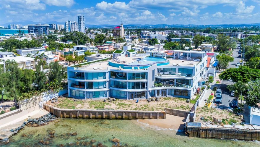 Understated luxury pervades the serenely elegant living environment, an inspired revelation of space, light, and form that balances grace and noblesse, boldness and restraint, rich complexity, and spare refinement. Welcome to Azure Beach at the gated Almendro Street in Punta Las Marias!

This spectacular oceanfront Penthouse conceived with contemporary architecture offering exceptional proportions and stunning views. The residence is exquisitely designed throughout 3,217 square feet, configured with three bedrooms each with a full bathroom, and a bonus room with a full bathroom, elegant marble floors throughout and a charming open terrace. The interior space exudes sophistication, combining comfort with style. The open floor plan seamlessly integrates the living, dining, and kitchen areas, creating a perfect environment for entertaining guests or enjoying quality family time. The fully equipped gourmet kitchen features sleek cabinetry and stainless-steel appliances.

Wake up to the gentle sound of waves and be mesmerized by the enchanting ocean vistas that stretch as far as the eye can see. The floor-to-ceiling windows and spacious terrace ensure that you will never miss the beauty of the surroundings.

Azure Beach is a resort-style development that would be impossible to duplicate today. Residents of Azure Beach enjoy the most impressive roof-top of any development in San Juan that includes an infinity pool and spacious open and covered terraces to entertain the most demanding guests. Seat and relax to witness dramatic sunrises and sunsets. The development offers a full power generator and water cistern.