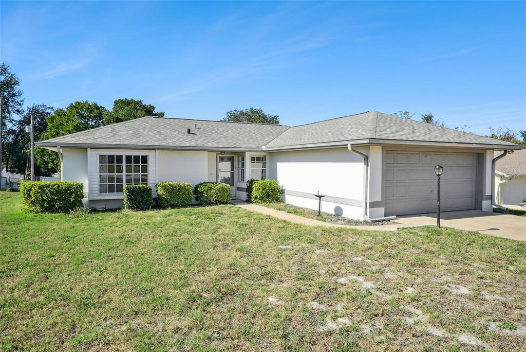 Photo of 2012 E Gloria Drive, Deltona, FL 32725 (MLS # O6369351)