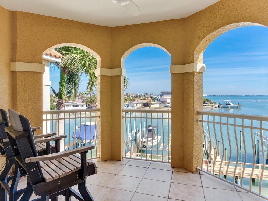 Experience elevated coastal living in the largest residence at Bella Grande, offering approximately 3,320 square feet of beautifully designed space with DEEDED BOAT SLIP #4. This exceptional top-floor condo (no noise from above) is located in the very quiet Building B which features just seven total residences, creating a peaceful, private atmosphere with stunning views of Boca Ciega Bay.  The home offers three spacious bedrooms; each is en-suite with a full bathroom plus a convenient half bath near the kitchen ideal for guests.  Designed for both comfort and entertainment, the layout includes two distinct living areas: one overlooking the resort-style pool and the other capturing sweeping bay views.  At the heart of the home is a completely remodeled kitchen (completed 2019) featuring Monogram appliances and an impressive, oversized island, with seating for four or more.  The space is perfect for gatherings!  Adjacent to the kitchen is a dedicated bar and wine area, complete with a dual-zone Vino Temp wine refrigerator with a 108-bottle capacity, a beverage cooler, and seating for five.  The private office with French Doors offers a built-in desk, drawers, filing cabinets, and shelving, making it ideal for working from home or managing personal affairs.  Boating enthusiasts will appreciate the deeded deep water boat slip (Slip #4), equipped with a 20,000 lb. lift.  Boardwalk and docks were substantially renovated in 2018 including incasing the piers in concrete. Boating access to the Gulf of Mexico is a short 15-minute boat ride. Additional premium features include two new 3-Ton 18 SEER variable-speed HVAC systems (new in 2023), a new 55-gallon water heater, two dedicated covered parking spaces, and an exceptionally large private on-site storage unit measuring approximately 21’ x 11.5”.  HOA is in full compliance with SIRS including robust capital reserves.  With its unmatched size, thoughtful upgrades, and prime waterfront setting, this residence offers a rare opportunity to own a truly special condo at Bella Grande.  This is a beautiful community where luxury, privacy, and the coastal lifestyle come together seamlessly. A quick 20-minute drive to bustling downtown St. Petersburg and all it has to offer and a short 5 min. walk directly across the street to the sugary white sands of the Top-Rated St. Pete Beach. Call today for your private showing!!
Bonus Boat Slip - If interested, a second boat slip (Slip #7) is available for purchase.  Slip #7 also features a 20,000 lb. lift.