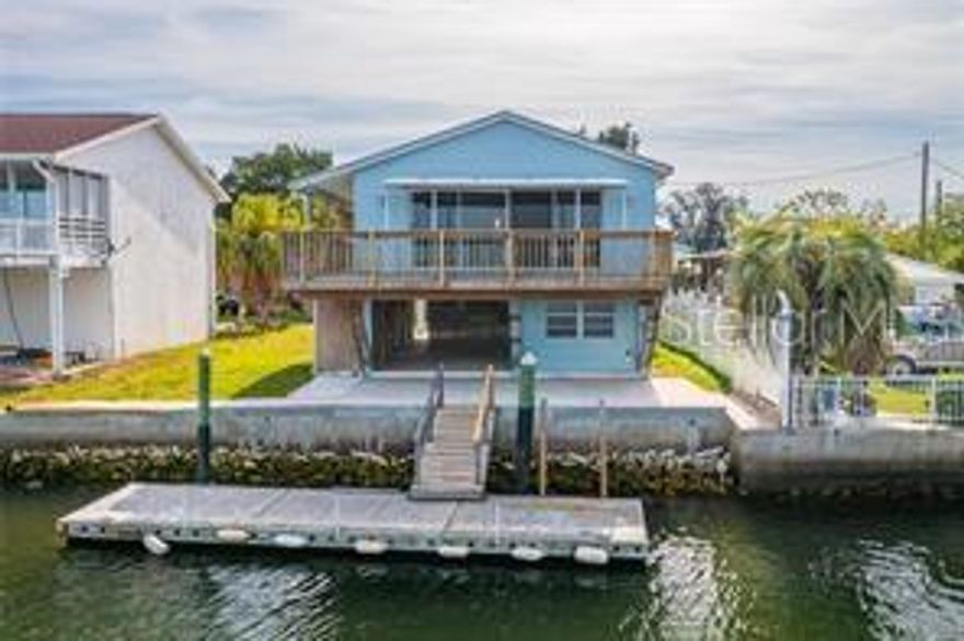 Escape to your very own piece of paradise with this inviting 2-bedroom, 2-bathroom home nestled in a serene waterfront setting. Just a short boat ride away from open waters, this property offers the perfect blend of tranquility and adventure. Imagine waking up to the gentle sounds of the waves lapping against the shore, with sunshine streaming through the windows to greet you each morning. Step outside onto your spacious open porch, where you can savor your morning coffee while watching the world come alive with vibrant colors. As the day unfolds, indulge in outdoor activities like fishing, boating, or simply lounging in the sun. And when evening approaches, there's no better place to unwind than on your porch, where you can witness breathtaking sunsets painting the sky with hues of orange, pink, and purple. Inside, the home boasts an open floor plan that seamlessly connects the living, dining, and kitchen areas, creating the perfect space for entertaining guests or simply enjoying quiet evenings at home. With ample natural light and panoramic views of the surrounding landscape, every moment spent indoors feels like a retreat. Ready to make this dream a reality? Don't hesitate—schedule your private showing today and discover why this waterfront oasis is the perfect place to call home. **Move in Ready **All information to be verified