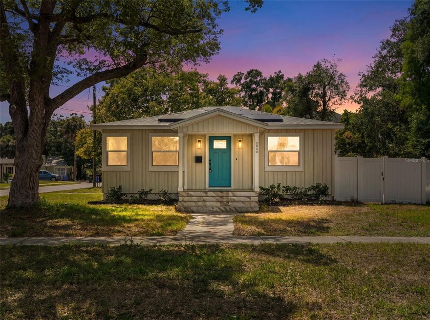 One or more photo(s) has been virtually staged. Welcome to 4600 21st Street N, a beautifully updated St. Petersburg home located less than 10 minutes from the vibrant heart of Downtown St. Pete. This charming 3 bedroom, 1 bathroom residence has been thoughtfully renovated from top to bottom, offering a rare opportunity for a buyer to move into a home where virtually everything has already been done. From the moment you arrive, the home’s fresh curb appeal immediately stands out with its new designer board and batten siding in a timeless almond color, crisp white fascia and soffit, fresh landscaping, new sod, shrubs, and a private white vinyl fence surrounding the property. The inviting front porch features brand-new tile work with Schluter edge trim for a clean, modern finish. Inside, the home feels bright, airy, and completely refreshed with fresh designer paint throughout in Sherwin Williams “Greek Villa,” complemented by abundant natural light and new waterproof, scratch-resistant luxury vinyl flooring flowing seamlessly throughout the entire home. Every detail has been carefully curated, from the matte black hardware and screwless outlets to the stylish new lighting and ceiling fans installed in every room. The kitchen has been fully renovated with new designer cabinetry, brass hardware and faucet accents, beautiful stone countertops, a garbage disposal, and a full suite of new Samsung stainless steel appliances. The bathroom has also been transformed with a stunning walk-in shower, updated vanity, and an illuminated defog mirror with three lighting settings, blending both luxury and functionality. Beyond the cosmetic upgrades, this home offers true peace of mind with major system improvements already completed, including a brand-new roof installed in October 2024, all new impact-rated windows and exterior doors installed in December 2024, a complete permitted and inspected plumbing re-pipe, updated electrical system, tankless water heater, and even additional structural foundation support added with two new steel beams. The fully PAID OFF solar panel system covers a vast majority if electric costs on your home, making ownership exceptionally affordable month-to-month creating long-term savings and energy efficiency that today’s buyers will truly appreciate. A new Samsung washer and dryer are also included, and you can even purchase the furniture for an additional expense making this home truly move-in ready with little left for the next owner to do besides enjoy! Whether you’re searching for a primary residence, winter retreat, or low-maintenance investment property close to downtown St. Pete’s restaurants, nightlife, waterfront parks, and entertainment, 4600 21st Street N offers the perfect combination of style, efficiency, and peace of mind in one beautifully renovated package.
