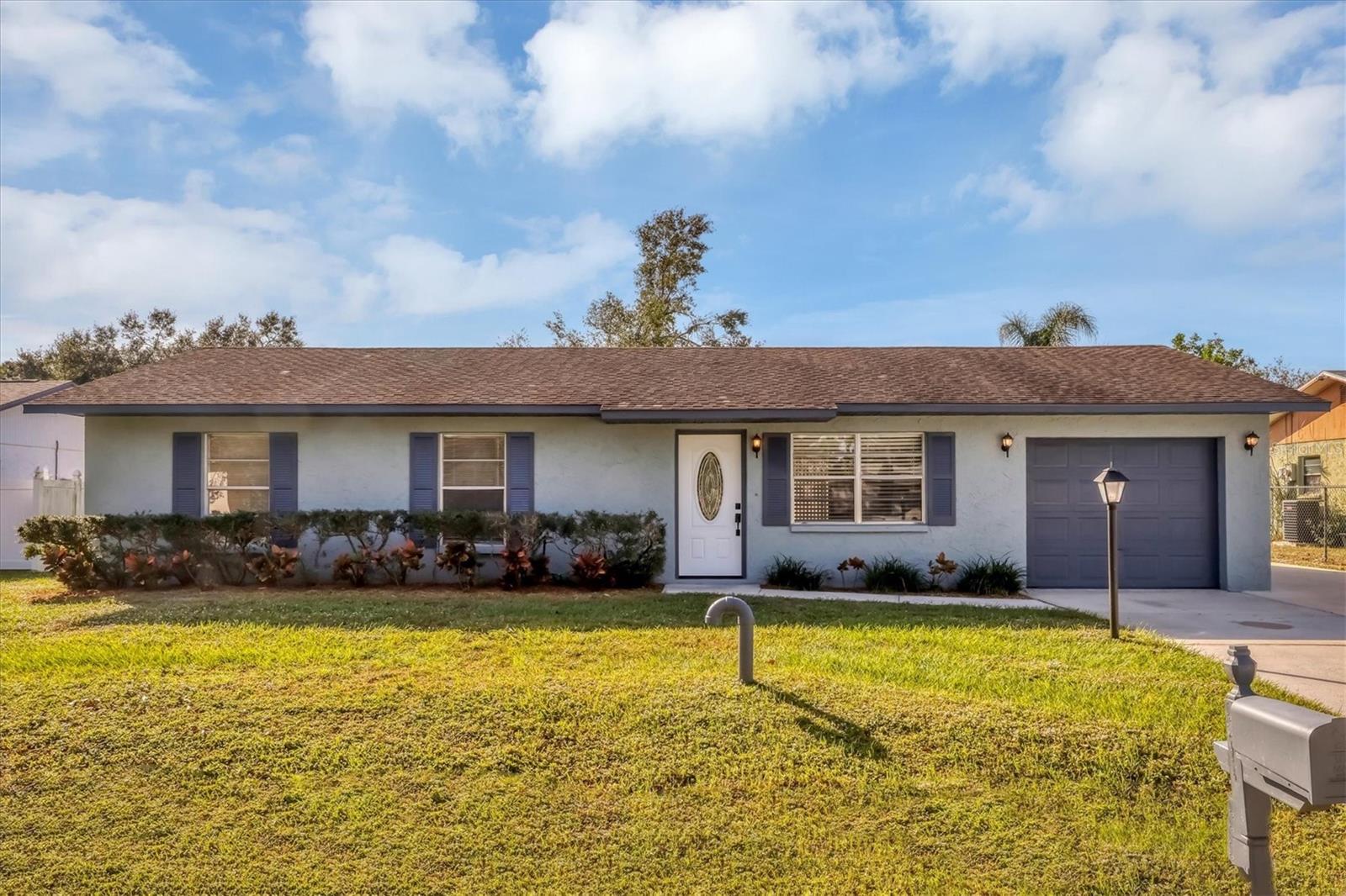One or more photo(s) has been virtually staged. Minutes from I75 and the UTC Mall, this move-in ready 3 bedroom / 2 bath home in DeSoto Lakes, a non-deed restricted community awaits. Freshly painted inside and out with laminate plank flooring and fresh carpet. A new glass-cut front door completed the new exterior finish . Not only does this home offer an oversized garage, but a paved parking pad for an extra car or recreational vehicle. Eat-in kitchen with stainless appliances and sliders providing access to rear patio. No flooding or damage after recent storms. Quick closing is available. Everyone will appreciate the access to Lido Beach and St. Armands Circle less than 10 miles away.
