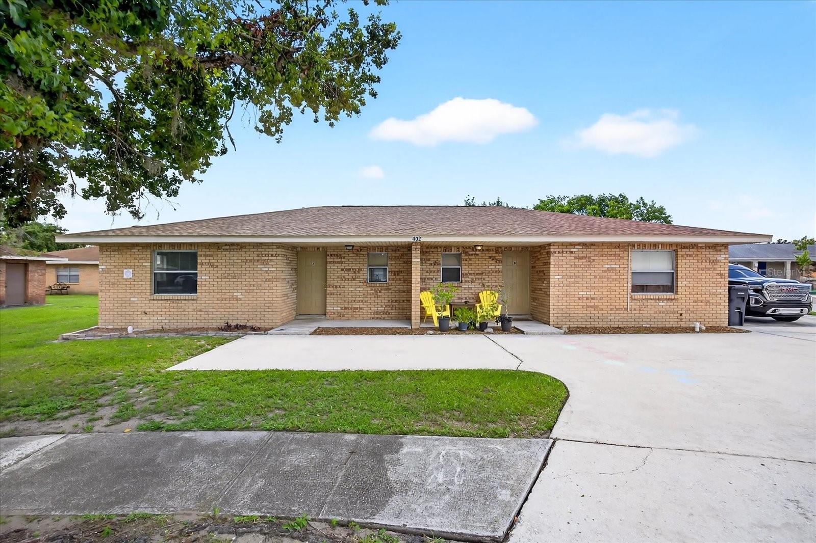 One or more photo(s) has been virtually staged. Is your portfolio missing a turnkey, meticulous-maintained, income-producing DUPLEX in a prime Brandon location? Whether you’re an investor or seeking multi-generational living, look no further than this large, 1,876 total square foot duplex, featuring two 2-bedroom, 2-bathroom, units that delivers strong financial opportunities. Ideally situated in a no-restrictions rental zone, No HOA, No CDD, and Flood Zone X; each unit showcases an open, sunlight, and spacious layout; high ceilings; generous primary bedroom with its own private en-suite bathroom, sizeable second bedroom, both with ample closets. Contemporary kitchen complete with a refrigerator, range, dishwasher, abundant cabinetry and bar seating is ready for entertaining. Unit A has been completely renovated with modern durable finishes and is move-in ready with luxury features including new granite countertops, cabinets, vanities; fixtures, beautiful LVP flooring, appliances, updated lighting, and fresh paint. Unit B is currently occupied with an on-time paying, stable, long-term tenant to continue your immediate cash flow. Both units also include in-unit laundry with washer and dryer and further storage; large private patios and a split backyard, perfect for relaxing while enjoying the peaceful, tree-lined, quiet surroundings; and concrete parking pads provide off-street parking with four spaces, two for each unit, for added convenience. This low maintenance, solid block duplex building has a new shingle roof (replaced December 2024), newer A/C systems, updated plumbing and fixtures; and has separately metered electricity and sub-meters for water for owner convenience as a tenant responsibility. With easy access to Tampa and major highways, this property enjoys all Brandon has to offer including shopping, dining, and entertainment. Consider residing in one side of the property to offset your living expenses or generate substantial immediate returns by cash flowing the entire property as a high-yield rental investment. Don’t miss this fantastic opportunity to own a solid income producing duplex in one of the most desirable rental markets. Schedule your private showing today! Also for sale is a matching triplex across the street. Please see MLS #TB8399225.
