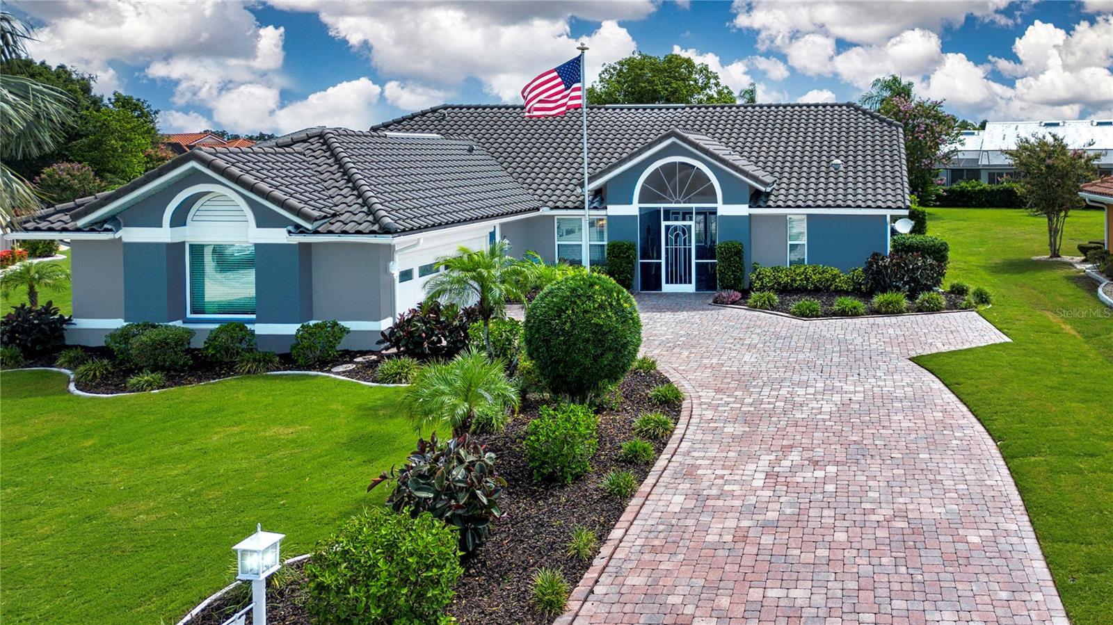 For the discriminating buyer that is looking for the best home in all of Sun City Center, look no further. The home is located in the 55+ retirement community of Sun City Center, FL, which was recently voted the number one retirement community in the country. This modified and highly updated Yorkshire model home is not to be missed! This is a 3 bedroom, 2 bath pool home featuring 2,150 sq. ft. of air-conditioned space and is situated on a quiet cul-de-sac. As you approach the home you are greeted with a paver driveway and outstanding landscaping along with a side load garage and a freshly painted exterior. The screened-in front porch is perfect for enjoying your morning cup of coffee and it has a large pull-down sunshade, if needed. You enter the home into the large great room which is flooded with natural light from both the front door, with double side lights and large transom window, and the sliding glass doors of the lanai. The openness of this space is expanded by the vaulted ceilings, a tiled wall with a stunning electric fireplace, a large screen TV, and a view of the free-form pool out back.
The remodeled kitchen will be the envy of your friends and neighbors with a cream-colored cabinet package featuring crown molding and a breakfast nook. The countertops are quartz with waterfall ends, and the back splash is tiled. All the appliances are stainless steel and there is a double stainless-steel sink and a convenient beverage cooler. The comfortable lanai is a great place to relax with a good book and transitions you from the kitchen or great room to the master suite. You enter the primary suite through French doors into a large sitting area and the spacious bedroom and ensuite. The vaulted ceiling of the bedroom also extends into the master bath. The beautifully designed master bath has a new double vanity, and a matching built-in cabinet providing plenty of drawer and counter space. There is also a linen closet and a generous well lighted walk-in closet. The second and third bedrooms have plenty of space for visiting family and friends or one room could be used as an office or craft room. The guest bath has also been totally remodeled with a beautifully tiled shower, new cabinets, and tiled backsplash and a comfort level commode. When you venture outside, pride of ownership is also very evident. A new front lawn was recently installed, and all the planting areas have had new mulch added. The lot is just over 5700 sq. ft. but you don’t have to worry about mowing. There is a GPS-guided, robotic lawn mower that continuously keeps the grass cut. When it needs to be recharged, it automatically goes to its charging station and once it is charged it goes back out to mow. The pool area is another fabulous retreat. A 4-person above ground hot tub is adjacent to the free-form shaped pool. For your added convenience, the pool has its own robotic pool cleaner with no in-the-way hose to deal with. An outdoor hot and cold water shower is adjacent to the pool enclosure. The side-load 2 car garage has a convenient back-out extension to the driveway eliminating the need to back out of the driveway onto the street. The garage has a remote-control roll-down screen, lots of storage shelves and a 5’x15’ storage closet. The list of improvements and upgrades goes on but the best thing for you to do is to make an appointment to come and see for yourself before it’s too late!