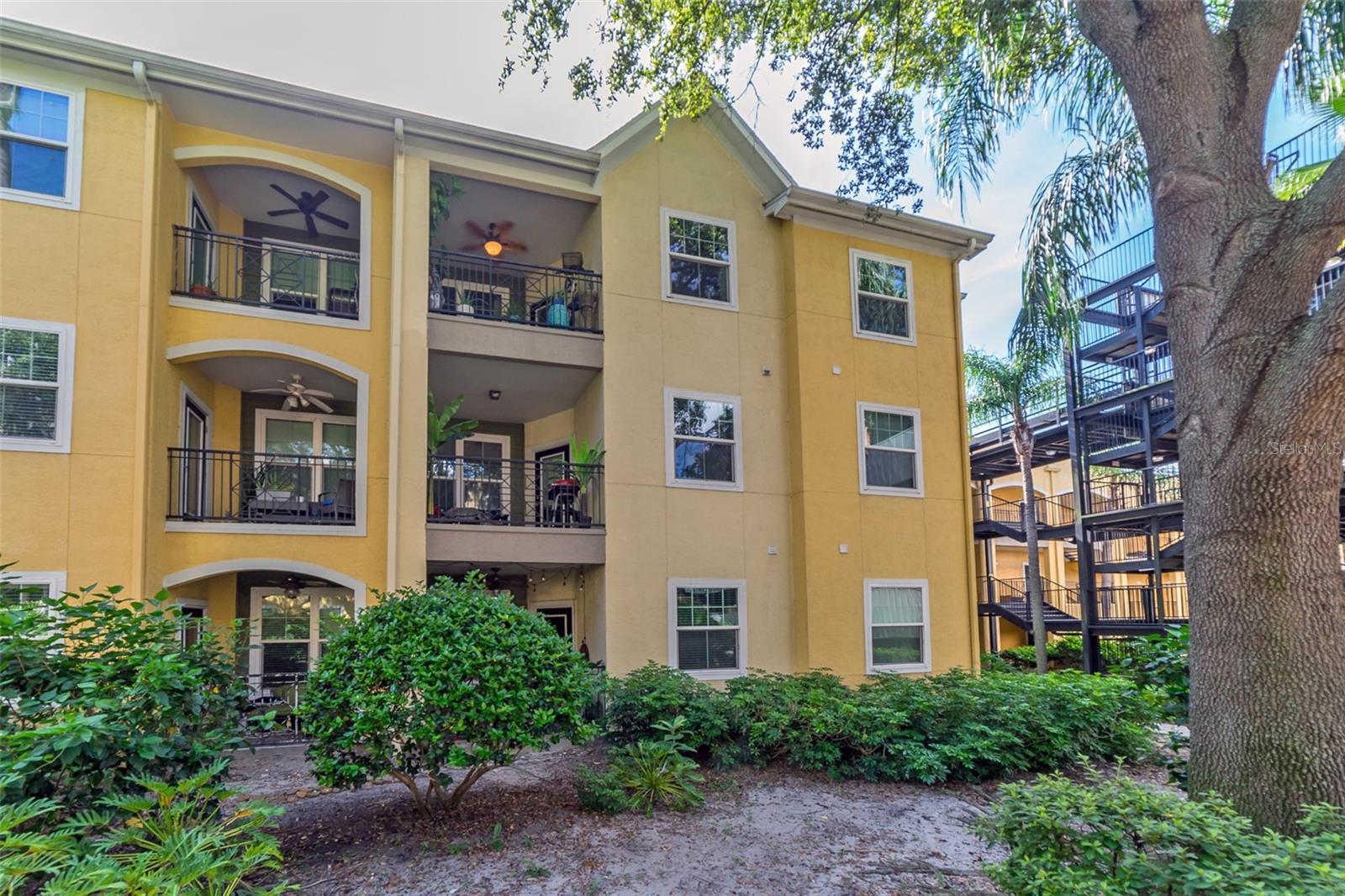 Stylish 2/2 Condo in the Heart of Ybor City!
Live where the energy of historic Ybor City meets modern comfort! Located just steps from 7th Avenue, this spacious and stylish 2-bedroom, 2-bath condo puts you right in the center of one of Tampa’s most walkable and vibrant neighborhoods. Enjoy easy access to restaurants, coffee shops, nightlife, and the TECO trolley—connecting you to Downtown, Water Street, Riverwalk, and more. Inside, the unit features upgraded ceramic tile floors throughout, modern fixtures, and a bright, open living area with a defined dining space. The kitchen includes stainless steel appliances, custom cabinetry, and a large sink with disposal—everything you need for comfortable day-to-day living.
A private balcony overlooks a quiet courtyard with a fountain, offering a peaceful place to relax just outside your door. The primary bedroom is generously sized, with an updated en-suite bathroom featuring a walk-in shower and contemporary vanity. A second full bathroom and bedroom provide flexibility for guests, roommates, or a home office.
The secure, gated community offers a full suite of amenities, including: two swimming pools and a jacuzzi, BBQ and picnic area, Fitness center, Clubhouse with full kitchen and pool table, Theater room, Covered parking, On-site property management and more. You’re just minutes from major highways including I-275, I-4, and the Selmon Expressway—making commuting easy no matter where you're headed. Whether you're a first-time buyer or looking for a low-maintenance place in one of Tampa’s most historic districts, this condo offers a smart mix of location, space, and updates.