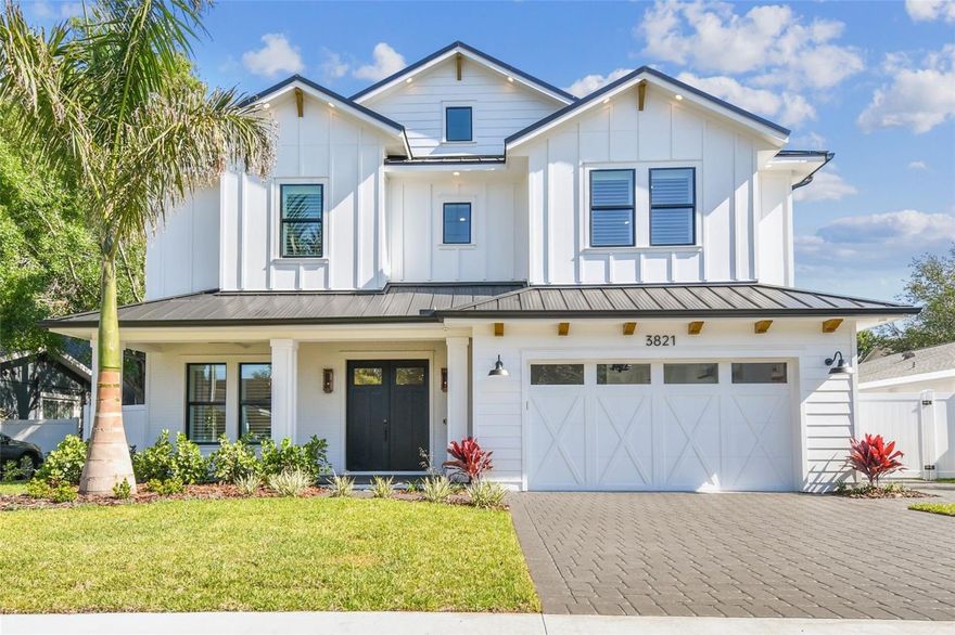 NEW CONSTRUCTION – Move-in ready modern farmhouse masterpiece. This 6-bedroom, 5.5-bath, 4,600-square-foot home sits on an oversized 67x120 lot within the highly sought-after Roosevelt, Coleman, and Plant school district. Designed and built beyond the building code, the home features an elevated foundation, standing seam metal roof, sealed building envelope with mechanical ventilation, all-Hardie exterior, and impact-rated, high-efficiency windows and doors. The 10-ft ceilings, 8-ft solid-core doors, spacious rooms (including four full suites), and Level 4+ smooth-finish drywall create a sense of grand luxury. Abundant windows and glass doors flood the open floor plan with natural light, highlighting wide-plank European white oak flooring throughout the home. The chef’s kitchen features an oversized island with seating for 6 to 8, Wolf and Subzero appliances, two gas ranges, an electric wall oven, microwave, dual dishwashers, a walk-in pantry and a wet bar with dual-zone wine cooler, beverage cooler, and RO-filtered water. The first floor also includes a spacious foyer, mudroom, powder room, flex room, two storage closets, gas fireplace with custom oak mantel and art frame TV, and a private guest suite with a walk-in closet and full bathroom with direct pool access. Outdoors, enjoy a fully automated saltwater pool and spa with heating and cooling, a large front porch, and a rear lanai with a complete outdoor kitchen. Upstairs, the primary suite features a tray ceiling, spa-style bath with soaking tub, double glass-enclosed shower with rain head and wand, dual vanities with makeup counter, two custom walk-in closets with built-in dressers, and a safe room. Three additional guest suites each include their own full bath and walk-in closet. A 14x20 media room with bar and beverage cooler, oversized laundry with dual washers and dryers, and an understairs storage room complete the second level. The home includes dual HVAC systems with UV purification and fresh air intake, an air-conditioned garage with Tesla charger, insulated door, and Wi-Fi opener with camera. Additional features include a whole-house water filtration and softening system, 400-amp electrical service, LED lighting throughout, over 120 light fixtures, under-cabinet and ambient lighting, and two tankless gas water heaters. A fully integrated smart home package includes hardwired security with touchscreen panels and motion sensors, Lutron Caseta, Hue lighting, Juke+ audio with five speaker zones, direct fiber internet, and Cat6 wiring to every room. A hardwired Eero system with three wireless access points ensures seamless, ultra-fast Wi-Fi coverage across the entire property. All closets have custom storage systems with extra shelving and all windows have premium plantation shutters installed. The exterior features upgraded landscaping with a variety of well thought out specimens, zoned irrigation, integrated landscape lighting, and underground electric for a clean streetscape. This brand-new residence by Suddath Homes Collection and Dorado Construction is completely move-in ready and includes a full 1-2-10 home warranty.