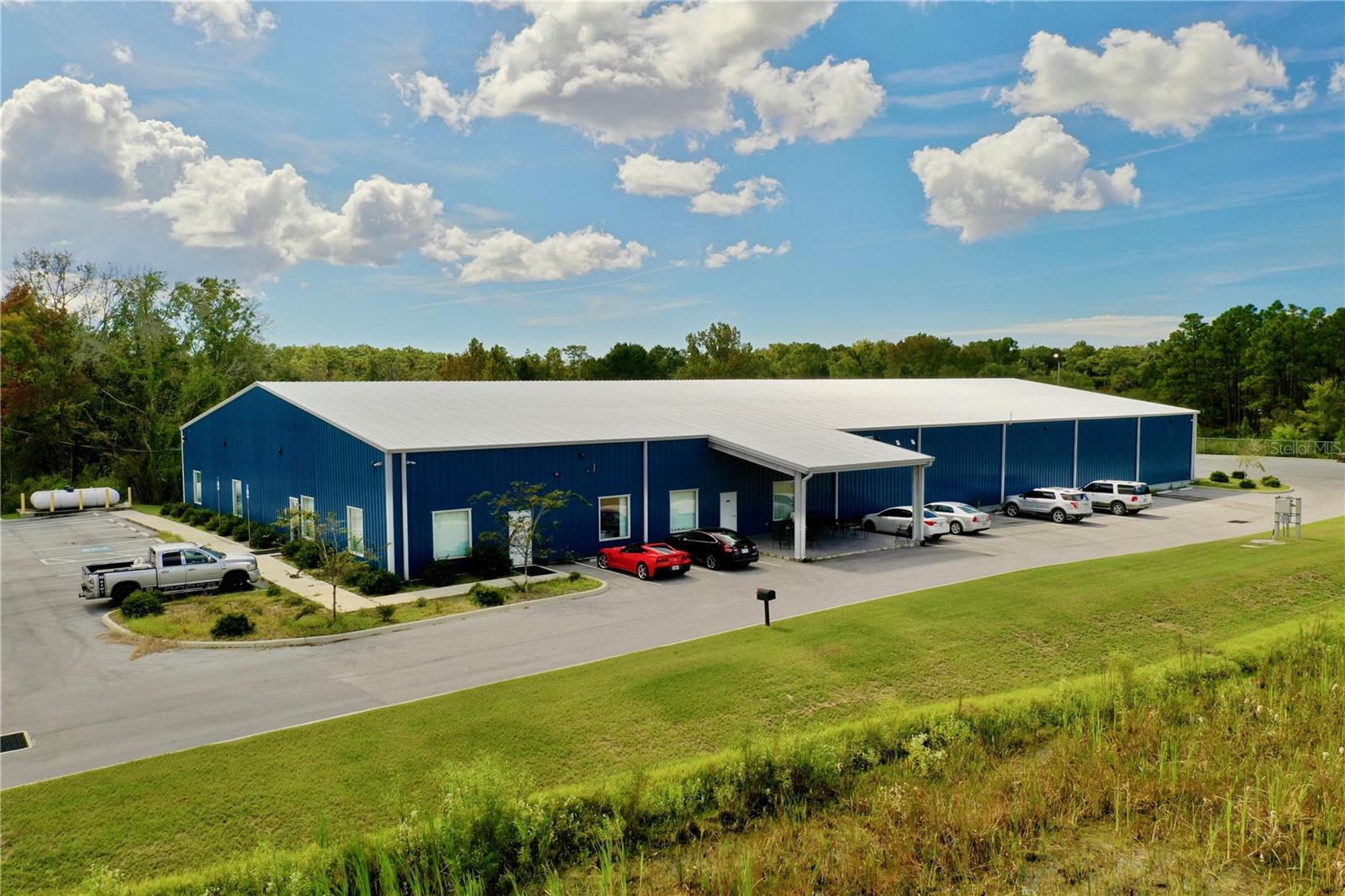 ****FOR SALE OR LEASE***20000 sf warehouse zoned IND located in Suncoast Industrial Park in Homosassa FL, Citrus County. Built in 2019, as-new condition inside and out. All under HVAC, with special filtration systems for climate control of environment for current use as health supplement manufacturer. Fire sprinkler and alarm systems part of build. Owner's office and reception area, bathrooms, nicely finished inside throughout main production areas. Large Capacity Standby Generator on site, 3 overhead loading doors with truck ramps and dip dock for semi trailers. Space is laid out and set up for ease of product movement. Can be easily adapted to new use. 1000 sf storage loft area, 500 sf covered side portico. Fully fenced and and above flood plain. Owner/Occupant may remain as Tenant if new Investor/Owner desires.
POSSIBLE LEASE-PURCHASE OPPORTUNITY