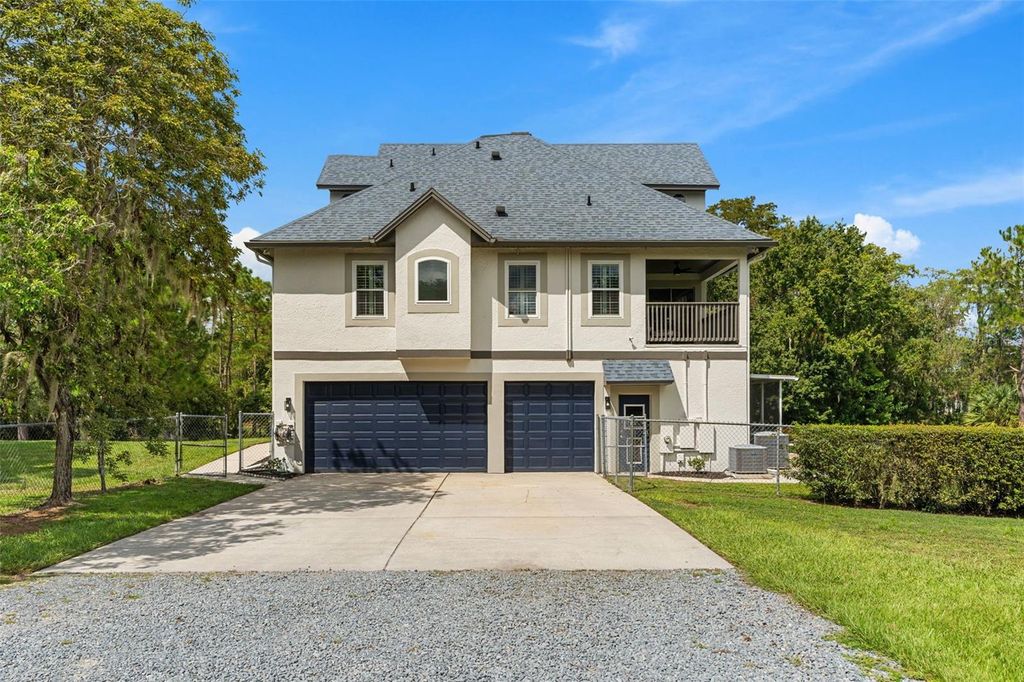 Photo of 16692 Lake Pickett Road, Orlando, FL 32820 (MLS # O6353074)