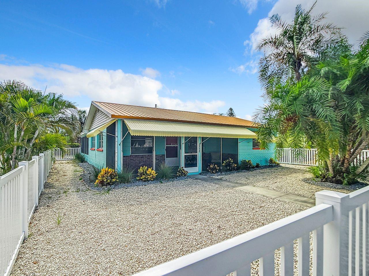 This Gulfport Beach concrete block home offers a perfect blend of style and functionality, located in the vibrant Art's District with a variety of activities and a great nightlife. As you step inside, you'll be greeted by a gorgeous, light-filled and thoughtfully designed open-concept floor plan, seamlessly connecting the living, family, dining room and kitchen. The kitchen is gorgeous and boasts new white shaker cabinetry, Vertrazzo (recycled glass) counters, and newer appliances. The two spacious bedrooms provide comfortable accommodations. Another standout feature of the home is the inviting & spacious screenroom leading you to a large private backyard oasis. The house has been freshly painted throughout; new fixtures, cordless blinds, also incudes a commercial grade water heater and metal roof.  In addition to its delightful features, this home is ideally located, being just a few minutes' walk to the beach, many unique and colorful stores and restaurants. With its prime location, unique amenities, captivating color scheme, and recent kitchen remodel, this Gulfport gem is more than just a home; it's a lifestyle. It's only 10 minute from downtown St Pete, 25-30 minutes to Tampa International Airport and just a few minutes from all the best Gulf beaches, restaurants and hospitals. Don't miss the chance to make it yours – contact us today to schedule a showing and discover the endless possibilities of coastal living. Walk to all things Gulfport, including restaurants, Tuesday morning Farmer's market, festivals, bars, galleries, pier, and shops! This home did sustain some damage during Helene but has been thoughtfully and professionally renovated. Schedule a showing today and immerse yourself in the coastal lifestyle that awaits. All information is deemed accurate but should be verified and is not warranted.