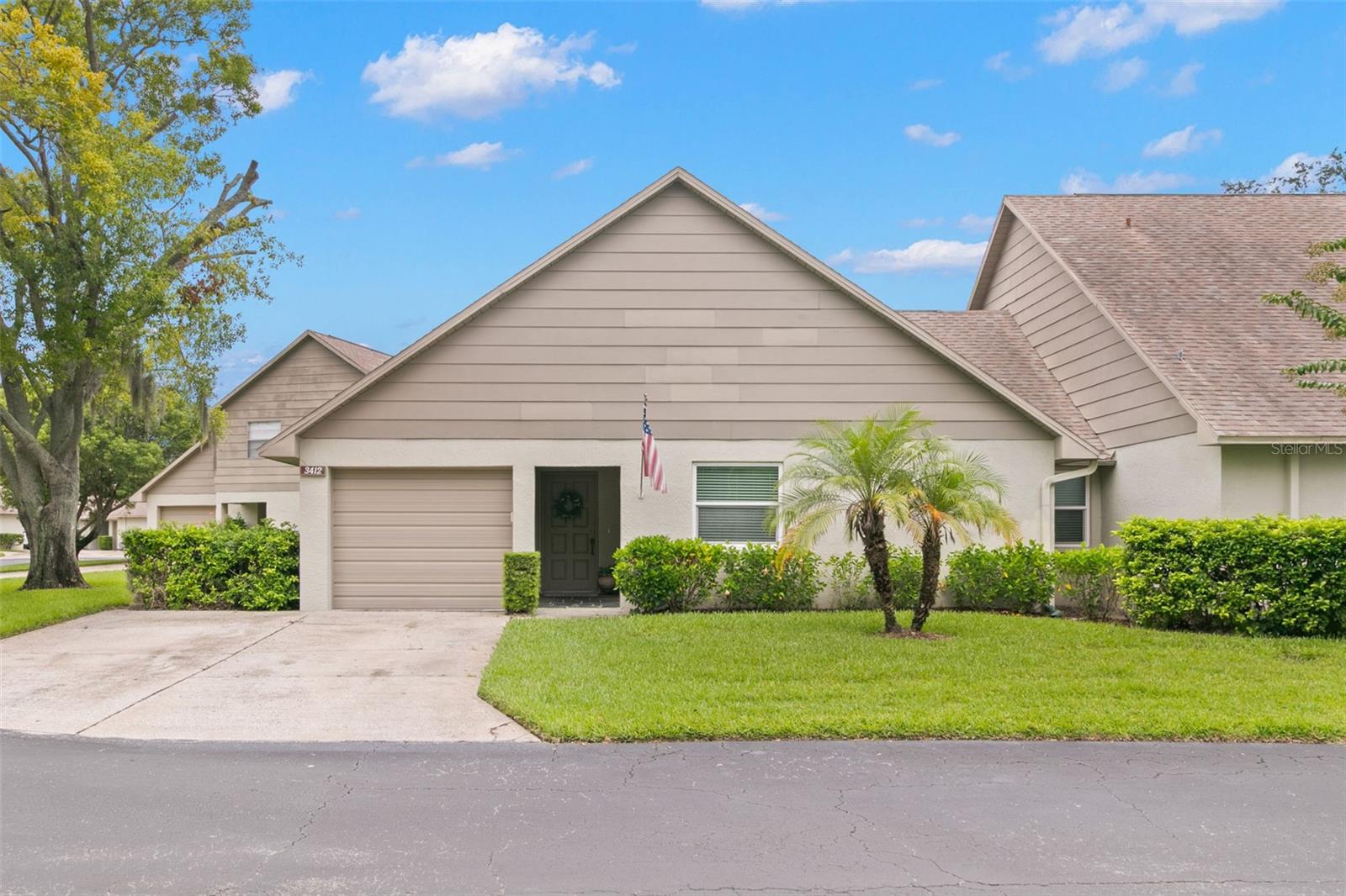 Welcome to Châteaux Woods, a sought-after community in the heart of Clearwater! This terrific 3-bedroom, 2-bath home offers a private 1-car garage, spacious living areas, and a prime location close to shopping, dining, beaches, and easy access to Tampa. Step inside to a large, light-filled living and dining room, perfect for entertaining or everyday relaxation. Sliding glass doors open to a versatile enclosed porch/bonus room, extending your living space even further. The modern kitchen features dark wood cabinetry, granite countertops, stainless steel appliances, and a double stainless steel inset sink. A breakfast bar, pantry closet with built-ins, and a second set of sliding doors to the bonus room make this kitchen as functional as it is stylish. The primary suite offers sliding door access to the enclosed porch, a generous walk-in closet, and a private en suite with an updated vanity and step-in shower. Two secondary bedrooms each offer a walk-in closets and share a full bath with a tub/shower combo. All bedrooms feature brand new laminate flooring and the main living areas feature tile flooring for easy maintenance. The laundry area is conveniently located in the garage, which also offers ample storage. Located mere steps away from the community pool, this home offers relaxation and recreation right outside your door. Plus, you’re centrally located near beaches, shopping, restaurants, and major roadways for a quick trip into Tampa. This home has been beautifully updated and maintained—there’s nothing left to do but move in and enjoy the Florida lifestyle. Schedule your showing today!