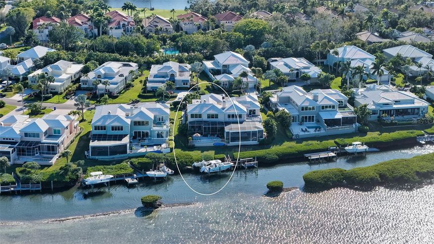 Located behind the gates of Corey’s Landing in the sought-after Bay Isles community, this direct bayfront residence offers an exceptional Longboat Key lifestyle defined by boating, waterfront views, and deeded access to a private Gulf beach. With its private dock and 14,000-lb boat lift, the property provides immediate access to Sarasota Bay for boating, paddleboarding, and sunset cruising, while the Bay Isles Beach Club offers owners exclusive Gulf frontage, beach pavilions, and convenient access to Longboat Key’s pristine shoreline.
Spanning 3,102 square feet across two levels, the four-bedroom residence is thoughtfully designed to capture natural light and water views while creating seamless indoor-outdoor living. The main living level is anchored by a dramatic bayfront living room with soaring cathedral ceilings, a gas fireplace, and walls of impact-rated glass sliders that open to a screened waterfront patio overlooking the bay.
Adjacent to the living space, the formal dining room enjoys its own water views and flows easily into the fully renovated kitchen completed in 2022. Designed for both everyday living and entertaining, the kitchen features Bosch stainless appliances, quartzite countertops, custom cabinetry, pantry storage, and a breakfast bar for casual dining.
The primary suite is conveniently located on the first floor, offering a spacious walk-in closet plus two additional closets and a private en-suite bath. Two additional guest bedrooms on this level—one currently used as a study—share a beautifully updated full bathroom. Upstairs, guests enjoy a private retreat with a loft-style bonus area featuring a built-in entertainment center and an oversized en-suite bedroom finished with elegant tilework.
Extensive upgrades enhance comfort and long-term value, including a new tile roof (2023), two A/C systems (2022), updated dock with 14,000-lb boat lift, remodeled kitchen and baths, recessed lighting, storm windows on the bayside, a new electrical panel, exterior lighting, updated landscaping, sprinkler system, and a new screen enclosure.
Corey’s Landing offers a maintenance-free waterfront lifestyle with 24-hour guard-gated security, community tennis courts, and a heated pool and spa. Ownership also includes deeded access to the private Bay Isles Beach Club, where residents enjoy Gulf-front relaxation with pavilion seating, beachside gatherings, and direct access to the white sands of Longboat Key.
Ideally positioned behind the gates of Bay Isles, this residence is moments from the Longboat Key Club’s championship golf and tennis facilities, nearby marinas, and island dining. St. Armands Circle, Lido Beach, and downtown Sarasota’s renowned cultural venues, galleries, waterfront parks, and restaurants are all within easy reach—bringing together boating, beach access, and the best of Sarasota’s coastal lifestyle.