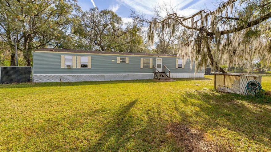 Great opportunity to own a 3 bedrooms, 2 bathrooms manufactured home built in 1996, offering 1,216 square feet of living space on a spacious 1.25-ACRE fenced lot in Lakeland. The home features an open floor plan with a functional layout and plenty of natural light. Located in an area with no HOA, this property provides flexibility and room to spread out, perfect for those seeking space, privacy, or a future investment. The large lot offers endless possibilities for outdoor use, storage, or expansion. The home is being sold AS-IS and will require some TLC, making it an ideal opportunity for investors or buyers looking to add their own personal touch. Conveniently located near shopping, dining, and major roadways. Don't miss out on this property and schedule your private tour today!