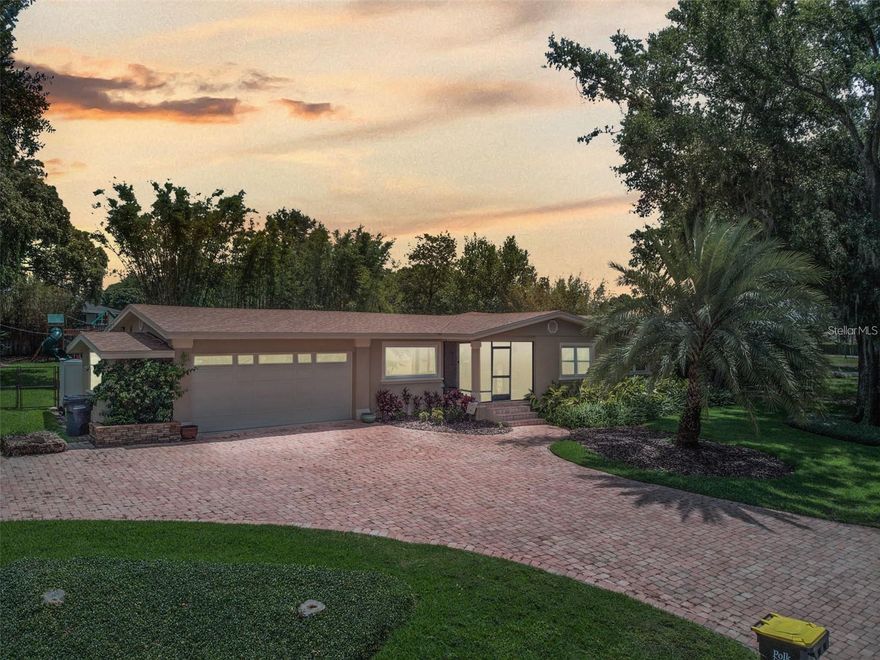 Experience the best of Winter Haven living in this beautifully updated 4 bedroom, 3.5 bath home offering Lake Lulu views and a prime central location just minutes from downtown, dining, and the Chain of Lakes. Thoughtfully designed with flexible spaces, you’ll find two primary suites, a warm family room with lake views, and French doors opening to a wrap-around screened porch—perfect for morning coffee or evening sunsets. The kitchen features granite countertops, custom maple cabinetry, and stainless appliances, while the formal living and dining rooms showcase original hardwood floors. A large paver driveway offers plenty of parking for guests or lake toys, and the fenced backyard is ideal for children or grandkids with a playground. A two-car garage with extra storage, double-pane windows, and recent updates complete this rare lake-view opportunity—no HOA and unbeatable access to everything Winter Haven offers.