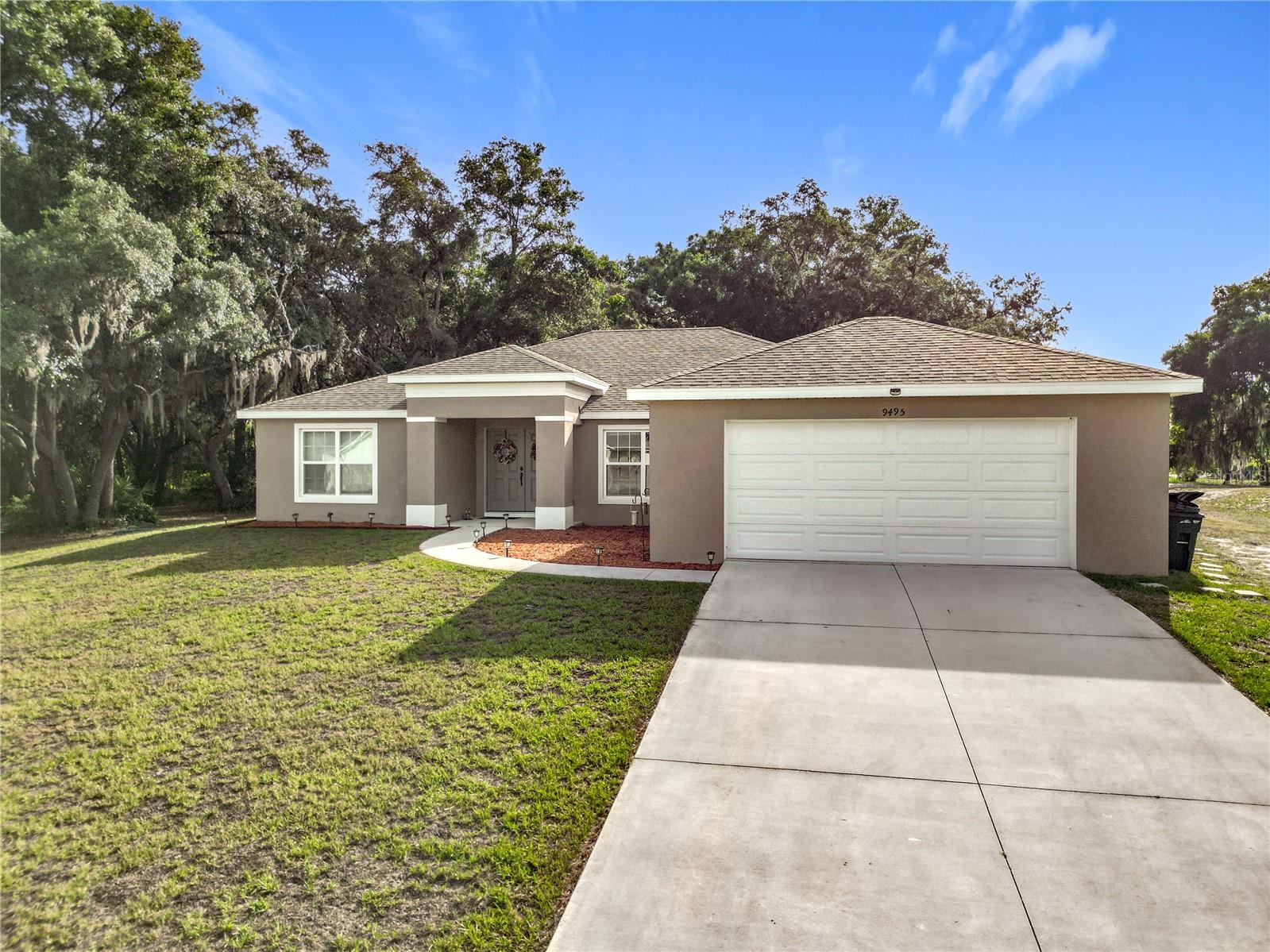 Buyer has the opportunity to acquire an additional lot next-door. On an Acre !Welcome to this stunning 5-bedroom, 4-bathroom home, built in 2023 and situated on a spacious corner double lot totaling just over an acre. Designed with both flexibility and comfort in mind, this modern residence is ideal for multigenerational living or anyone seeking extra space and privacy.
A private mother-in-law suite with its own separate entrance provides the perfect setup for extended family, guests, or rental income potential. Inside, the home boasts a bright and open floor plan featuring tile flooring throughout for a clean, cohesive look. The gourmet kitchen shines with sleek cabinetry, granite countertops, stainless steel appliances, and a large island—ideal for both everyday living and entertaining.
The primary suite offers a peaceful retreat with modern finishes and ample space. In addition to the five spacious bedrooms, the home includes a versatile flex space—perfect for a home office, gym, craft room, or anything your lifestyle demands.
Energy-efficient solar panels help reduce utility costs, and the large corner lot enhances privacy and curb appeal. Enjoy being just minutes from the downtown area with convenient shopping and dining options, plus easy access to the nearby boat launch and beautiful views of Davis Lake. Whether you’re hosting friends or enjoying quiet moments at home, this property is designed to adapt to your needs and elevate your everyday living.