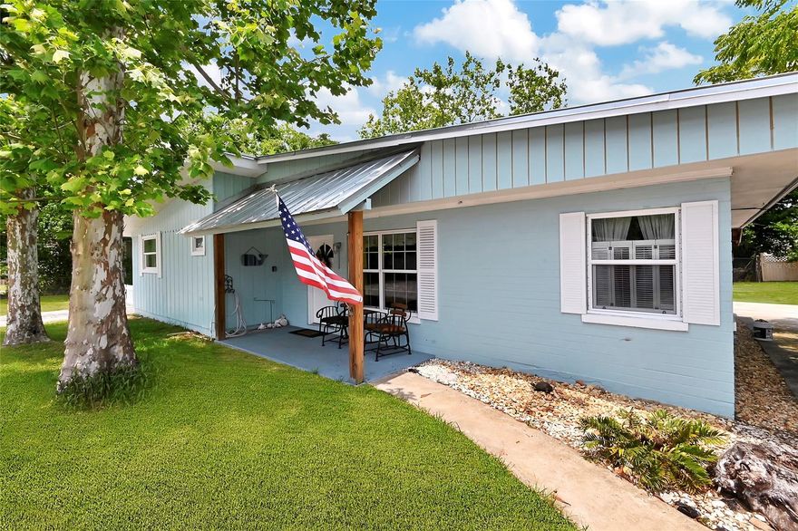 This fully renovated 3/2 Edgewater home has TONS OF GARAGE SPACE! It is zoned B-3 with a residential overlay so it has lots of usage options and INCOMING PRODUCING possibilities. There are two buildings. Up front is the residential house with driveways on both sides that lead toward the detached garage building in the rear. The house has fully updated electric, new water heater, new windows, barn doors, stainless appliances, new fixtures and more. Master bathroom has a zero-entry shower. Large inside utility room with laundry, utility sink and plenty of storage. All bedrooms are good size and currently accommodate king size beds. There is enough space in both the side and rear yard to park multiple RVs, boats, etc. Both 30 and 50 amp hookups in place. The detached garage has space large enough to park up to seven cars! Could also be used as an inexpensive warehouse! This building features three separate units. The east unit measures 13x29 and has a rear bathroom. The middle unit measures 20x29 and has a steel I-beam useful for a hoist. Both have 9’-wide doors. The west unit measures 30x34 and 15’ high ceilings (12’ entry clearance) with gated security and a Rotary Memphis car lift. There is also a small workshop in the rear with a storage room. The current owner rents out the house and uses the garage as personal storage and work space. Possible uses include auto storage/repair, machine shop, wood working, yard retail, boat repair and more. Located in the heart of Edgewater only a quarter mile to Edgewater City Hall, Police Station and Kennedy Park public boat ramps for Intracoastal access. Priced more than $22k below previous appraised value! Seller will consider owner financing. This home did not flood during Hurricane Ian. ;Water: City