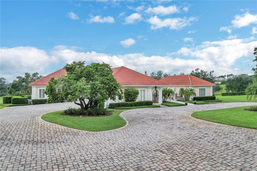 Imagine an elegant, yet charming single-story home that was originally constructed in 1986 but in 2018 under went extensive updates and renovations, blending the best of modern comforts with its classic foundation. This picturesque residence sits atop a sprawling five-acre estate, offering breathtaking vista views of the surrounding natural beauty. The exterior of the home retains its distinctive architectural features including the prominent Ludovici red tiled roof that not only adds a splash of color but also helps to maintain a cooler temperature inside the home. There are also arched doorways and windows which are a hallmark of this style that add a sense of elegance to the home. Additionally, there is a lovely courtyard patio, offering a seamless transition between indoor and outdoor living. As you step inside, you’re greeted by an expansive foyer leading into a large formal living room with gas fireplace and expansive windows that frame the breathtaking vistas. From here, dine in the beautifully decorated formal dining room or step out into the bright, airy sun room where you can soak in the natural beauty. The kitchen, the heart of any home, boasts state-of-the-art appliances, quartz countertops with large island and beautiful custom cabinetry. This kitchen is a dream come true, with more than ample space for culinary creativity all while enjoying the hillside views through the large windows in the adjacent cozy family room. The bedrooms are spacious and well-appointed, with modern bathrooms featuring luxurious fixtures and finishes. The primary suite offers a private office, spacious his and her vanities, walk-in closets with built-in drawers and dressing areas, a large walk-in shower and a ‘tea for two’ jetted soaking tub. This beautifully designed and updated home provides the perfect flowing floor plan for entertaining and offers a blend of classic charm and modern comfort that will make every day feel like a retreat.