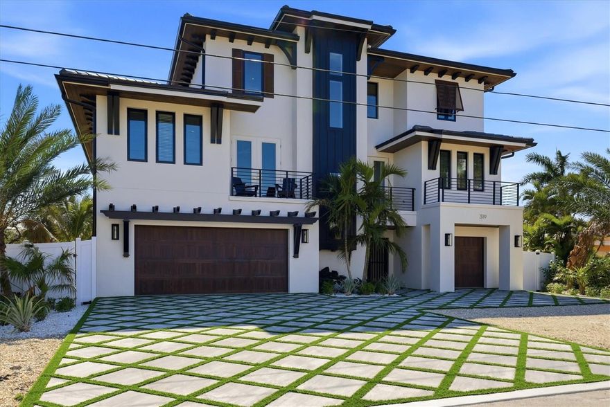 New construction waterfront estate offering over 7,000 square feet of stunning indoor-outdoor living, delivered fully turnkey furnished. Positioned on a quiet dead-end street, this 5-bedroom, 5.5-bath residence captures sweeping long canal views from every level along a 75’ wide waterway. Designed for modern coastal living with elevated finishes, open-concept spaces, and seamless indoor-outdoor flow. A chef’s kitchen anchors the main living area, while well-appointed bedrooms provide comfort and flexibility. Built to current coastal standards with elevated construction, reinforced systems, and a full-service elevator. Outdoor living features a resort-style pool, multiple entertaining areas, and a dramatic third-floor balcony with panoramic water views. A premier island listing that combines luxury, privacy, and exceptional waterfront living.