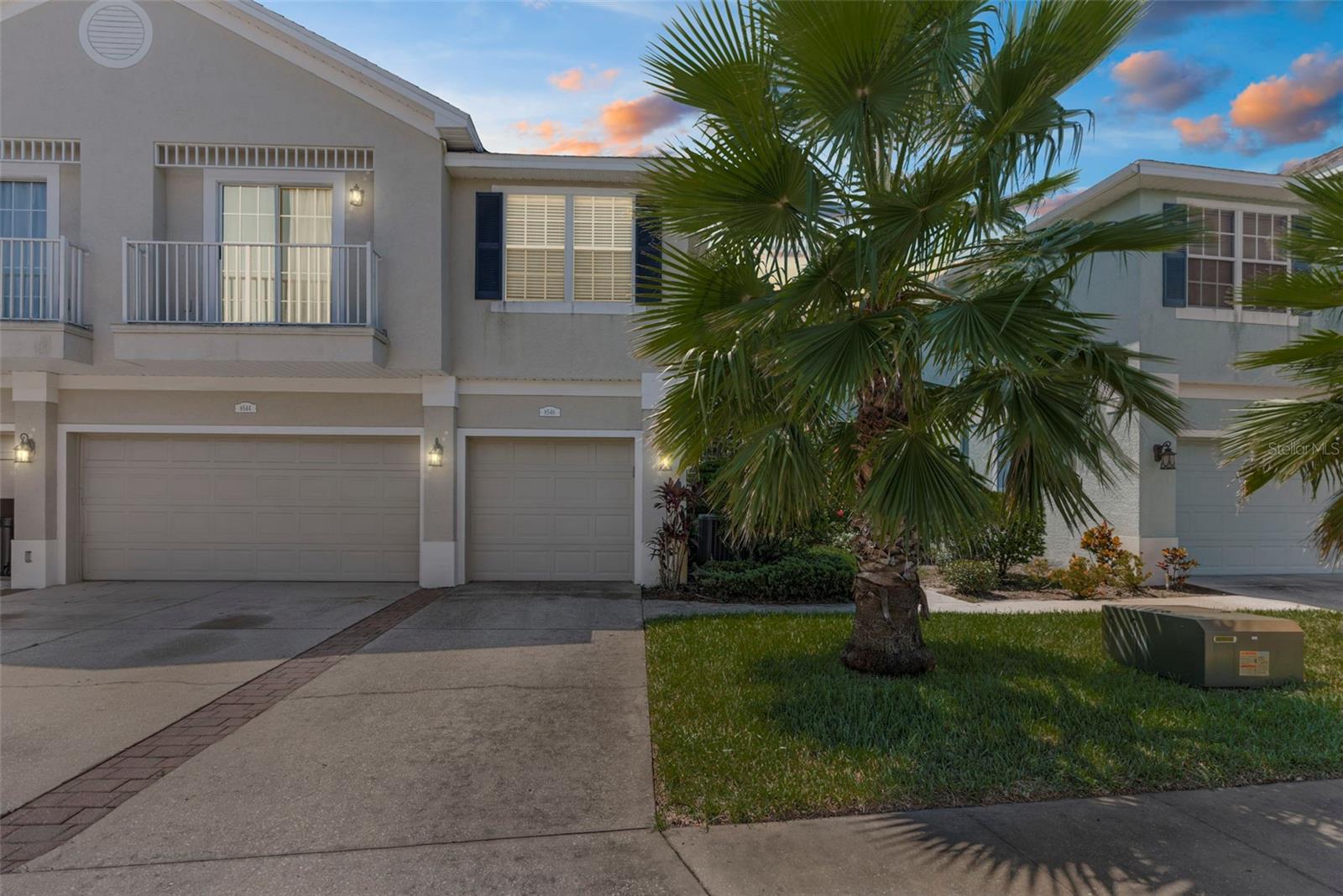 Welcome to Little Creek – A Highly Sought-After Gated Community!
This meticulously maintained and move-in ready 2-bedroom, 2-bath townhome offers 1,176 sq. ft. of comfortable living space with a split-bedroom floor plan and a 1-car garage, multi-use space. You’ll love the NEW ROOF (2022) and NEW AC (July 2022), new refrigerator and dishwasher (2025), new luxury vinyl floor, from steps and throughout dining, kitchen and living areas and newly carpeted bedrooms. Newly installed dryer ventilation ducts also installed 2025. Remote Gate access and pool key included.
Step inside through a private foyer and be greeted by a bright, open living area with vaulted ceilings that create a spacious, airy feel. The oversized great room features a living/dining combo and double sliding glass doors, built in shelving, two Cinderella balconies, which fills the home with natural light.
The chef-friendly kitchen boasts abundant cabinet space, Corian countertops, a breakfast bar, a built-in desk which doubles as a coffee bar, a tile backsplash, updated lighting, an under mount sink, garbage disposal, GE stainless-steel refrigerator (2025), GE dishwasher (2025) and pantry closet.
The primary suite features vaulted ceilings, a large closet, and an ensuite bath with dual under mount sinks, Corian counters, and a private water closet. The spacious guest bedroom is conveniently located next to the second full bath. You’ll also enjoy the inside laundry room and maintenance-free living with LOW HOA fees that include community pool, exterior maintenance, roof, water, sewer, trash, lawn care / sprinkler care, insurance on structure and gated security.
Community amenities include a heated pool and beautifully maintained common areas. Perfectly located near shopping, restaurants, medical facilities, churches, golf courses and parks including Starkey Wilderness Park and Sim’s Park.
Don’t miss this opportunity—schedule your showing today and see why owners love living in Little Creek!