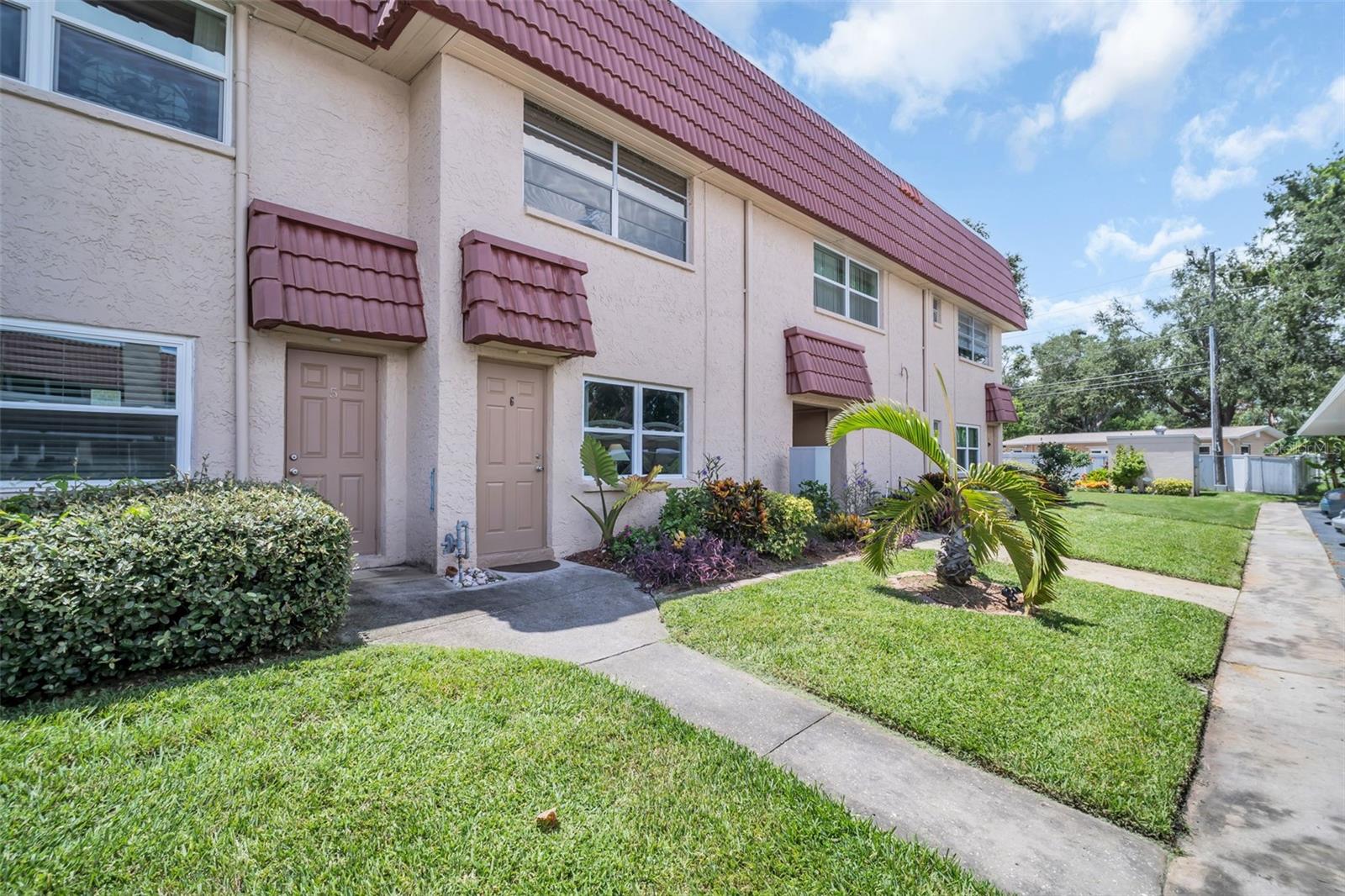 Welcome home to Long Bayou — a vibrant, gated 55+ community just minutes from the Gulf beaches! This beautifully maintained first-floor 1-bedroom, 1-bath condo offers a fantastic combination of comfort, convenience, and resort-style amenities. Inside, you’ll find high ceilings, newer double-pane windows, and a bright, open layout. The kitchen features a ceramic tile backsplash, gas stove, and newer appliances, while the bathroom includes a remodeled walk-in ceramic tile shower. Flooring is a stylish mix of luxury vinyl plank and ceramic tile. The spacious bedroom includes a large walk-in closet while the versatile Florida room is perfect as an office or relaxation space. Optional furnishings include a queen-sized sleigh bed with two nightstands, desk, sofa, end tables, and TV. The HVAC was installed in 2021. Long Bayou’s extensive amenities make every day feel like a vacation: heated pool and spa overlooking scenic Long Bayou Lake, shuffleboard, tennis, bocce ball, and natural gas grills with picnic areas. The clubhouse features a dance hall and stage, bar, large kitchen, TV lounge, billiard hall, piano lounge, library, workshop, fitness center, and even an arts & crafts room. Located just 2.5 miles from the beach and close to shopping, dining, the Pinellas Trail, and public transportation, this pet-friendly community offers low-maintenance living with monthly fees covering water, gas, cable, sewer, trash, insurance, lawn care, security, and building maintenance. Whether you’re seeking a full-time residence or a seasonal retreat, this hidden gem checks all the boxes. Call to schedule your private showing today—opportunities like this don’t last long!