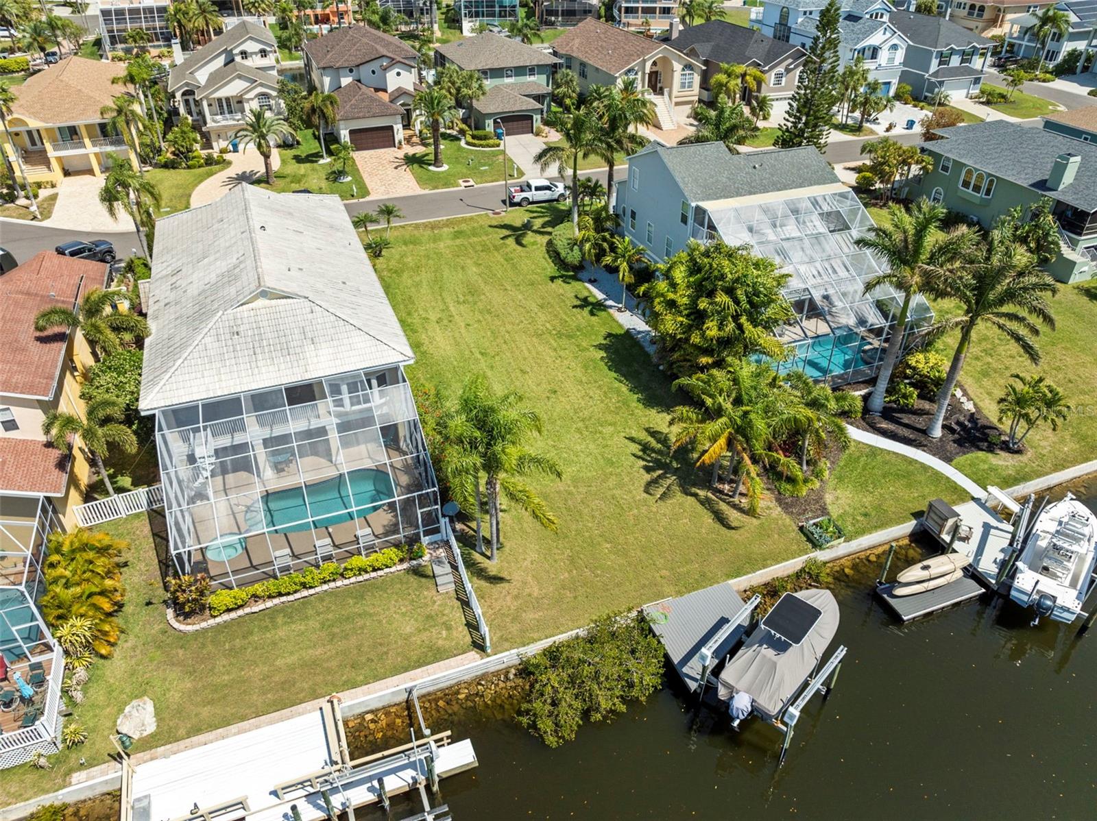 Discover the ultimate Florida lifestyle at 4330 Sanddollar Ct, a premium waterfront lot located on a deep water canal with direct Gulf access — no bridges, no hassle, just open water minutes away.
This exceptional lot is ready for your dream home with completed soil samples, a survey to be provided, and architectural plans for a stunning custom home included in the sale. A dock and 12,000 lb boat lift have already been installed, saving you time and money while getting you one step closer to enjoying life on the water.
Located in the desirable Gulf Harbors Sea Forest community, this property comes with low HOA dues and access to exclusive amenities including Gulf Harbors Private Beach Club with sugar-sand beach access, Community clubhouse, pool, dock, and tennis courts
Whether you're ready to build now or planning for the future, this lot offers the perfect blend of convenience, luxury, and location. Opportunities like this don’t come around often — call today for more info or to schedule a tour!