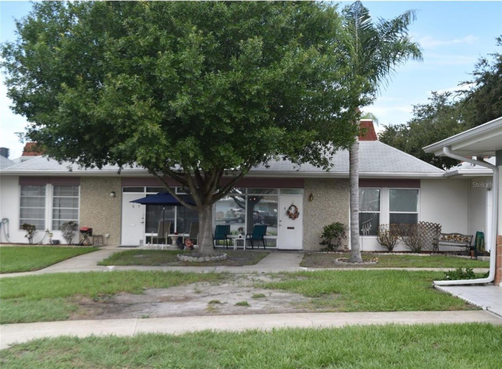 This Tahitian Gardens villa is in a 55+ gated community (AT LEAST ONE TENANT MUST BE 55 YEARS OLD) The condo comes
fully furnished. The owner may consider allowing a small dog. The villa features newer appliances, countertops, and
Laminate plank flooring in the bedrooms, hall, and living room. A newer stackable washer and dryer are
conveniently situated in the utility closet, offering ample storage space. Additionally, the unit is equipped with a newer
AC system, an Impact Hurricane window, an assigned parking spot, and a guest parking area near the unit. Enjoy the
heated swimming pool 24/7 year-round. The community offers a variety of activities and hobby clubs, including
shuffleboard, arts and crafts, a bicycle club, bingo, dominoes, Golfing resident club and card games. The location provides easy access to
shopping and public transportation, with Dunkin Donuts, CVS, Walgreens, and Aldi Supermarkets just a few minutes
away. Tampa and Clearwater airports are less than an hour away, just minutes from Tarpon Springs, the Sponge Docks,
and Howard Park Beach.