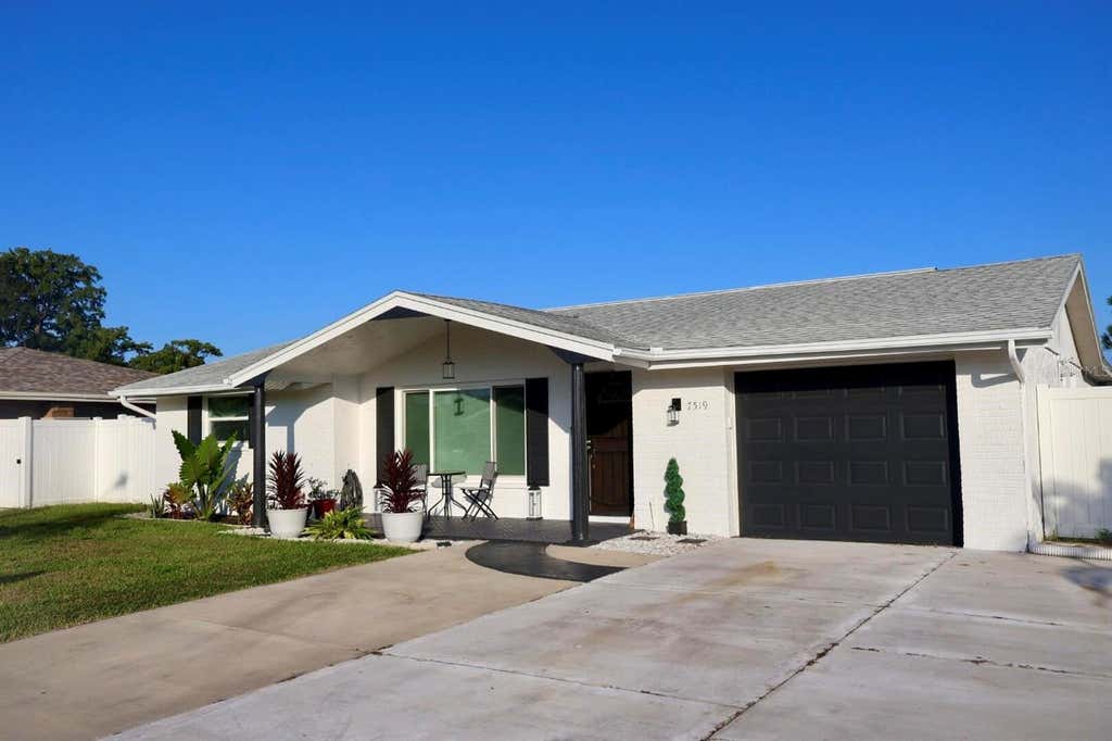 Photo of 7519 Holly Lake Lane, New Port Richey, FL 34653 (MLS # O6433969)