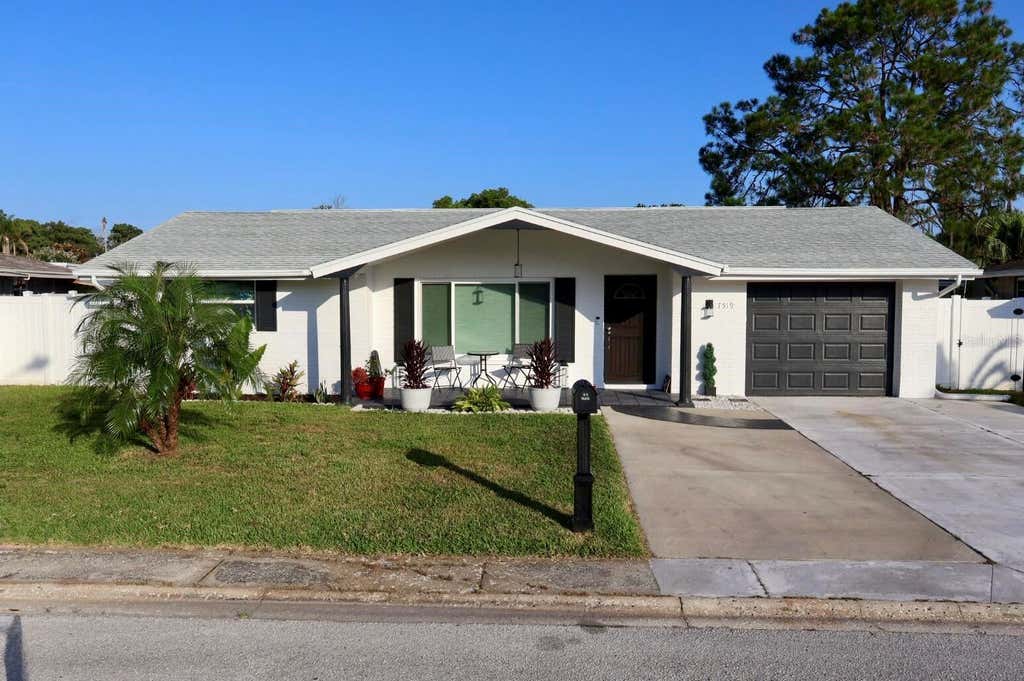 Photo of 7519 Holly Lake Lane, New Port Richey, FL 34653 (MLS # O6433969)
