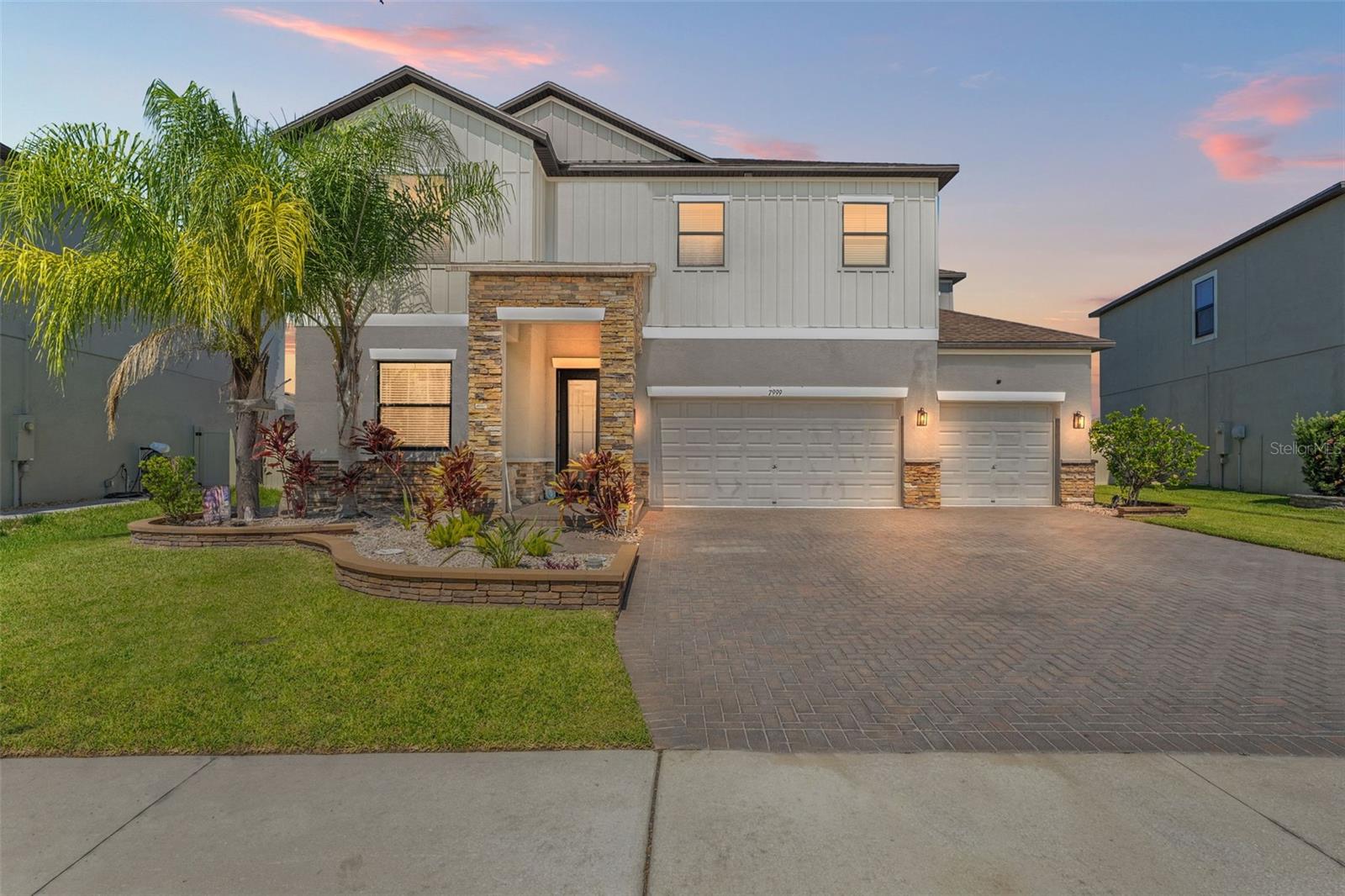 Welcome to a better than new pool home nestled in the highly sought after community of Epperson Ranch in Wesley Chapel. With over $208K in custom upgrades, this home has been meticulously enhanced to offer resort-style living both inside & out. Step outside to your private oasis featuring a newly built heated saltwater pool with a tanning ledge & waterfall, surrounded by an expansive paver patio, a screened enclosure with two exit doors, elegant pool lighting, & a cozy firepit area complete with the fire pit & outdoor furniture included perfect for relaxing or entertaining. Enjoy unforgettable movie nights under the stars with your very own 180-inch motorized projection screen, projector, 75" outdoor TV (also included), & a built-in surround sound system that transforms your backyard into a full cinematic experience. The upgrades continue inside, where you’ll find all new appliances including a refrigerator, stove with air fryer, dishwasher, microwave, washer, & dryer. A new front door welcomes you into a thoughtfully updated interior with new ceiling lights and fans in every room, a beautiful new chandelier, & decorative curtains & rods that enhance the home’s charm. The downstairs office features brand new carpet, while the spacious master bedroom boasts a custom closet organization system for ultimate functionality.
The garage is a showstopper with overhead storage racks throughout, a tool wall system, drawers, work station, & cabinets perfect for any hobbyist or organizer. Additional highlights include all new sod & landscaping, a double gated privacy fence with solar fence lights, outdoor ceiling fan, dog door in the enclosure with an insert into the house, and newly installed French drains throughout the backyard for optimal drainage. Life at the Lagoon is like nothing else. The Epperson Lagoon Community is in close proximity to Publix Plaza at Innovation Springs (you can ride the golf car over), Starbucks and Chick Fil-A. The Epperson HOA quarterly fee is only $237 per quarter and includes cable + the fastest internet in the nation, Ultra-Fi. The Crystal Lagoon Membership Fee is $137 per quarter. The closest Elementary Schools are Innovation Preparatory Academy, Watergrass Elementary School & Wesley Chapel Elementary. The Kirkland K-8 Charter School just a few blocks away! The closest middle school is Thomas Weightman Middle School. The nearest high schools are Kirkland Academy of Innovation High School and Wesley Chapel HS. The community features “Street Leaf” (solar streetlights), home of the first Crystal Lagoon, where Residents have access to Elam Park & the dock at King Lake, Paddle Boarding, Kayaking, a Wibit Obstacle Course, Cabanas, AquaBanas, Sandy Beaches, Live Music Events, Swim Up Bar and Resident Only Events. The Lagoon is like an Outdoor Clubhouse. The Holiday/Seasonal Events include Trivia Night, Family Night, Movies on the Lawn, Sounds of Summer (live music series), Karaoke, Pumpkin Patch in November, Golf Cart parades, Cinco de Mayo Resident only celebration, Fourth of July Resident Only celebration and much more. The Epperson Community Amenities include an Eagle’s Nest Part, a dog park, and golf cart paths. This home is located about 10 minutes away from KRATE (the new outdoor mall), 35 minutes north of Downtown Tampa, 45 minutes from Tampa International Airport, and 90 minutes from Orlando and Walt Disney World theme parks. Floor plan available in the photos, video tour available on YouTube, search by address.